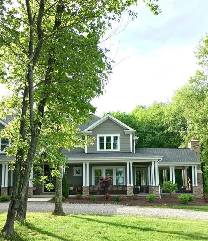 Modern farmhouse painted with Cabot Solid Stain in Pewter Gray - Farmhouse Redefined.