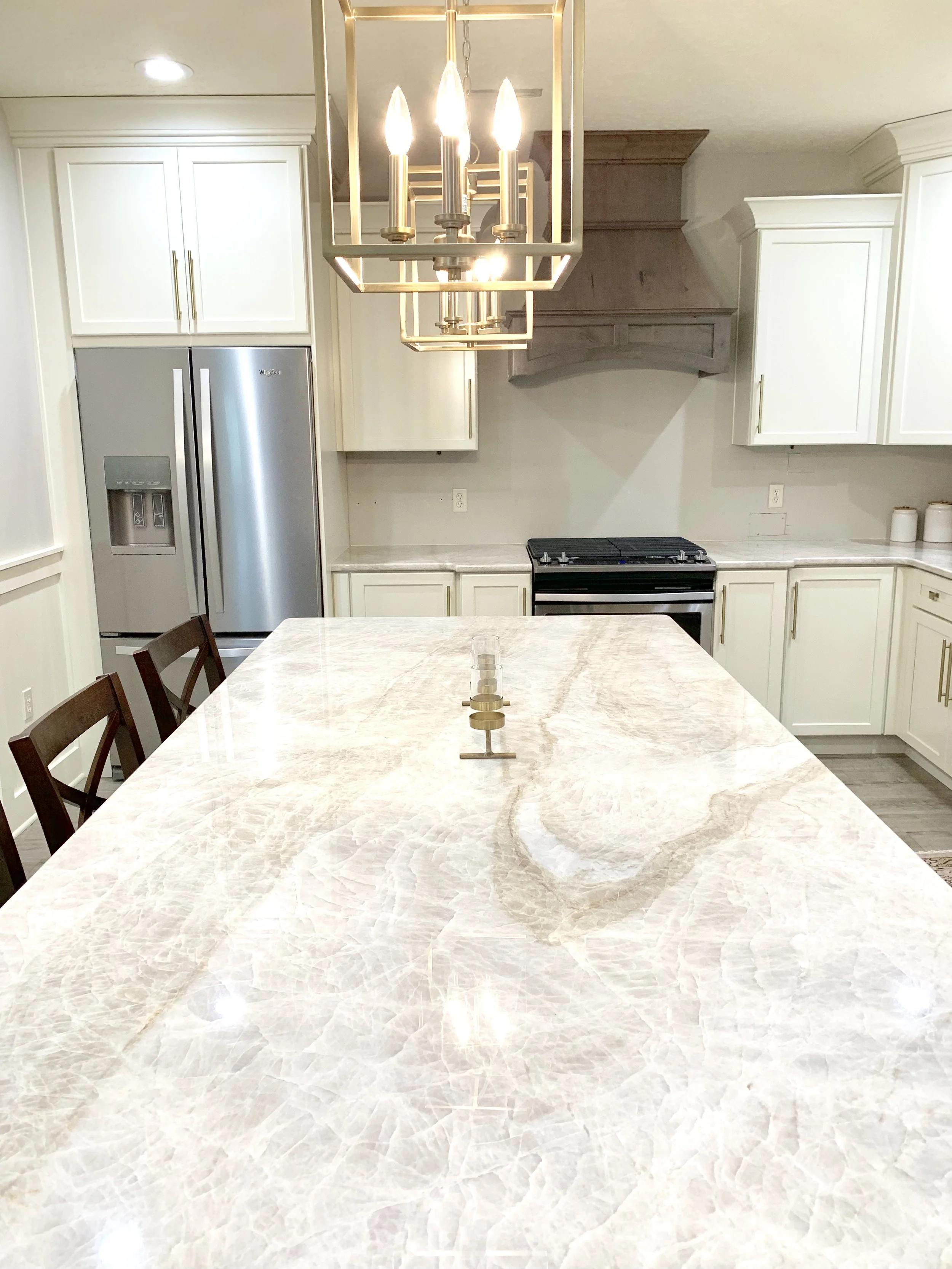 Taj Mahal quartzite countertops in modern farmhouse kitchen by Farmhouse Redefined.