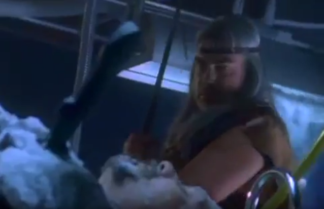 Note the knife in his chest.