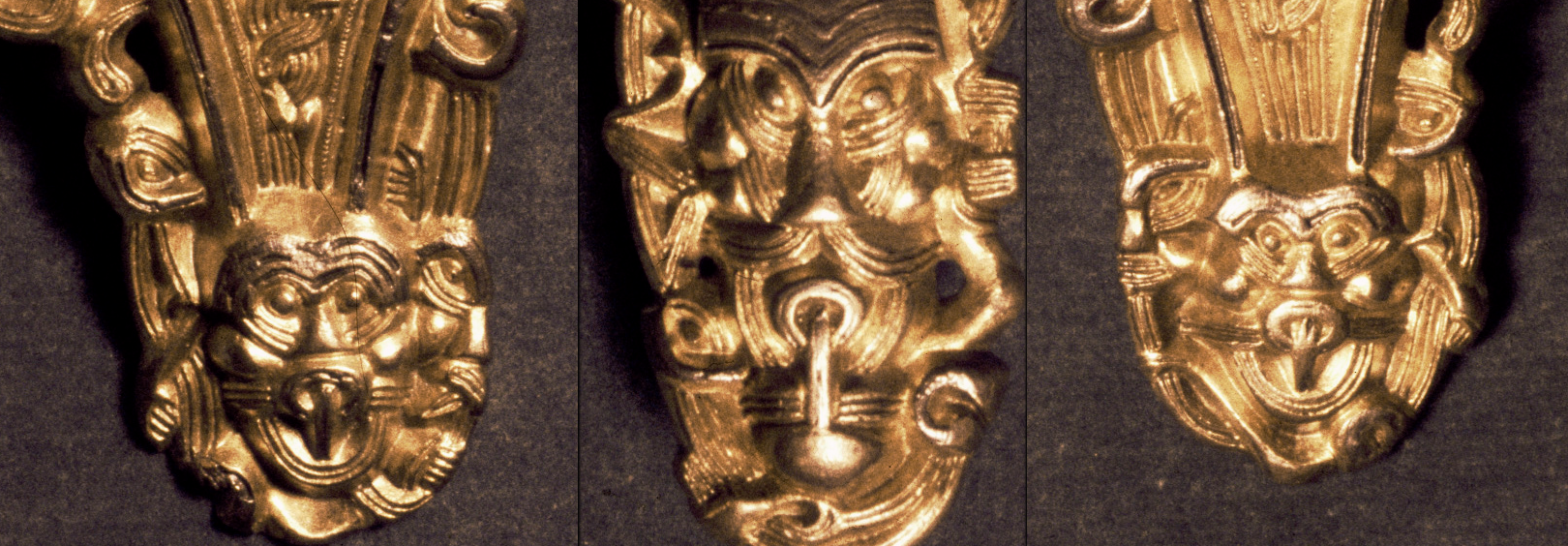 Detail of mask ornaments on a Migration Era brooch from Fonnås, Norway. See the whole thing here