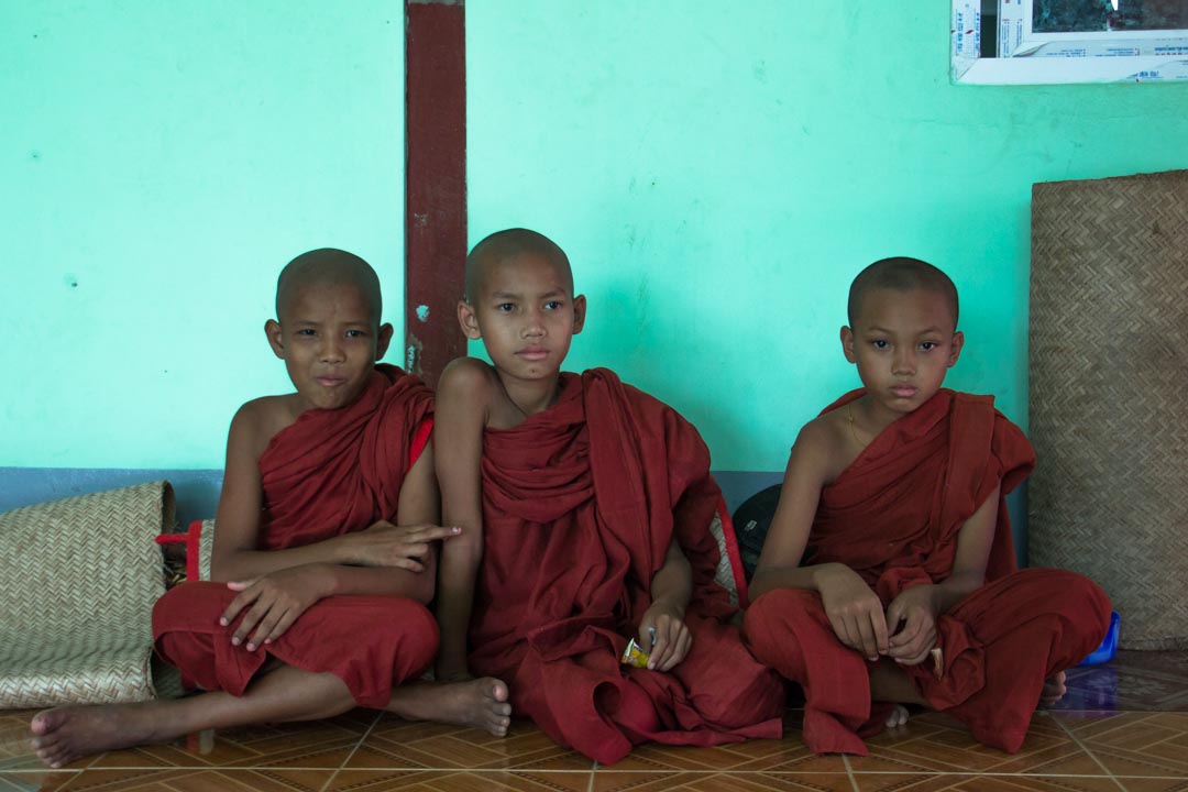  Three young monks take a rest between studies in a monastery on the outskirts of Yangoon, Myanmar. April 2013.  