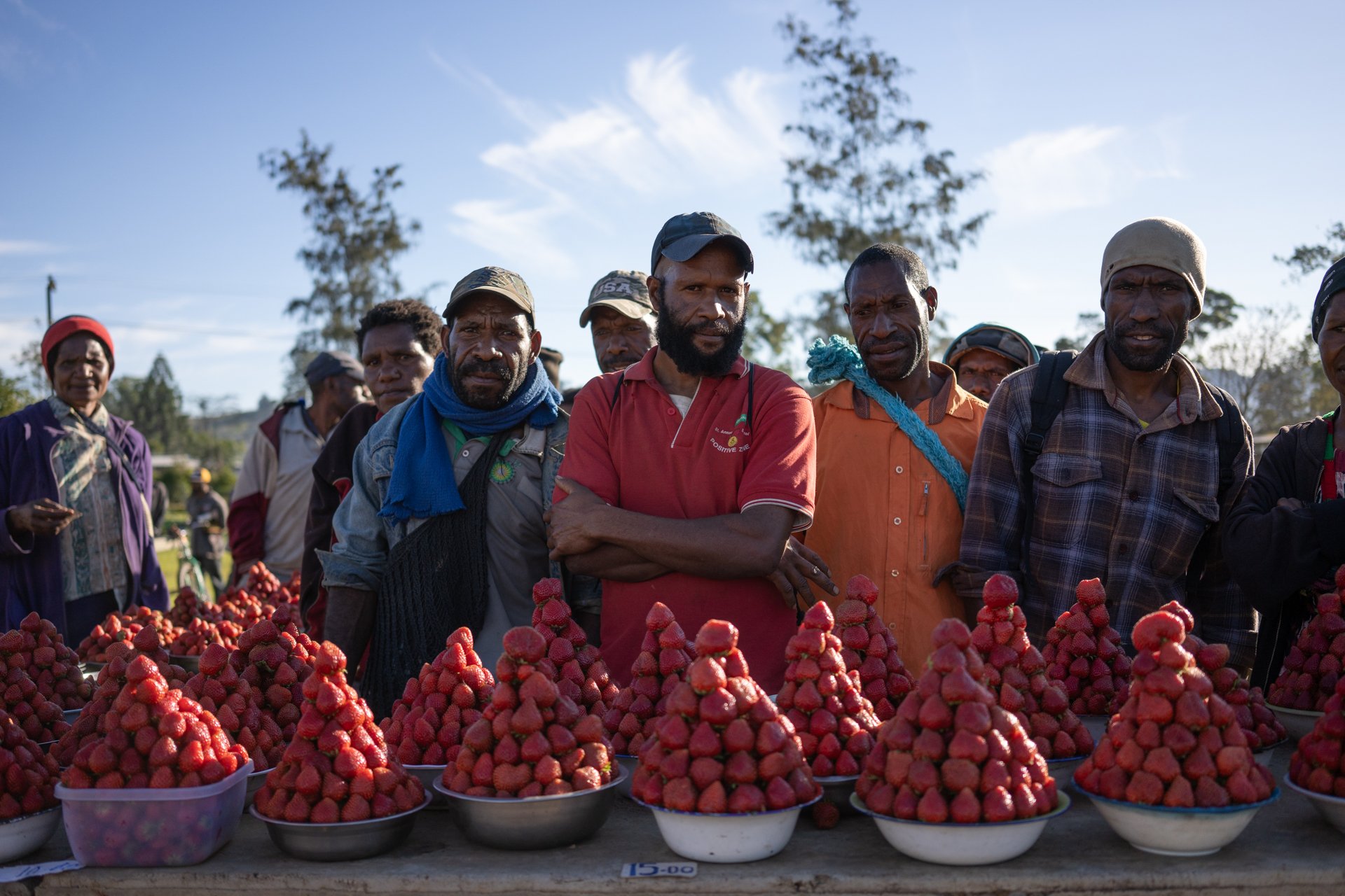  Villagers selling strawberries in Goroka, Papua New Guinea. August 2019.  
