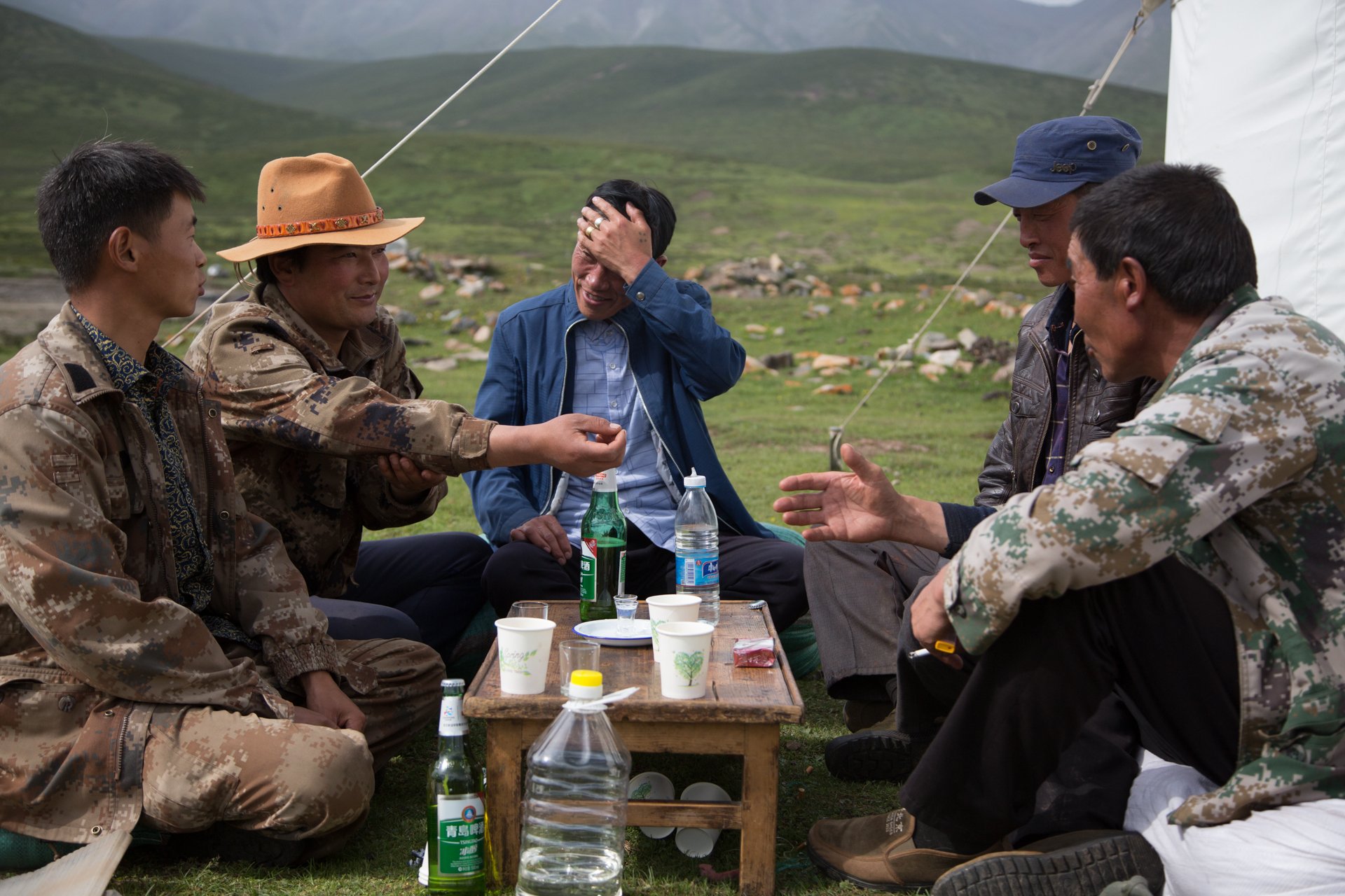  The village men rest after a long week of catching and shearing yaks for families throughout the village. Dechen, Gansu. July 2019 // Shot for Yakma 
