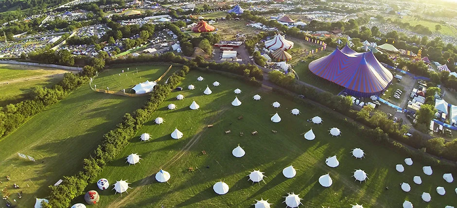 Aerial-datytime-over-tipi-field.jpg