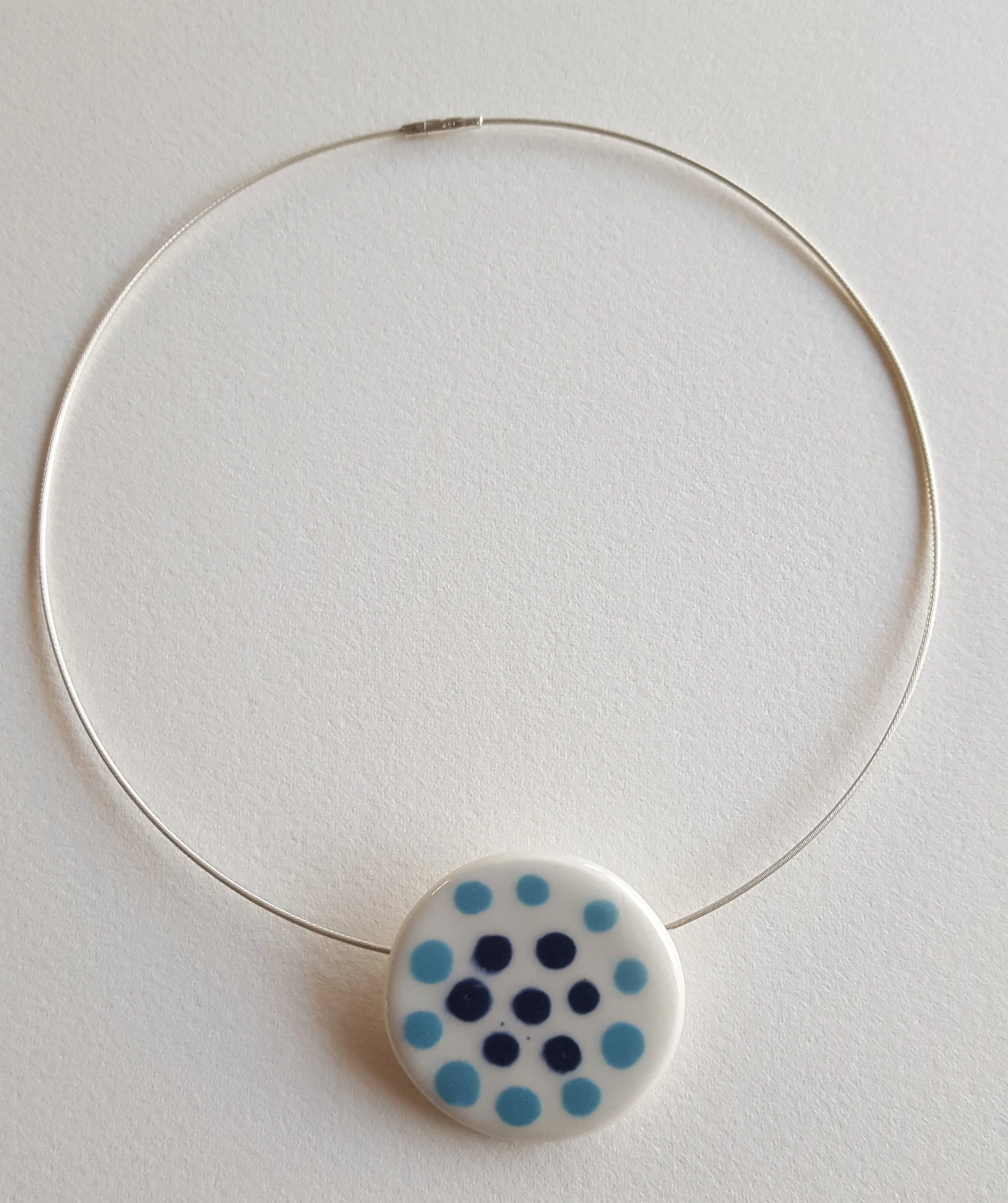 Porcelain Slip decorated disk on Sterling silver neck wire