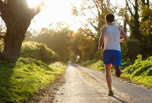 getty_rf_photo_of_man_jogging_in_woods.jpg