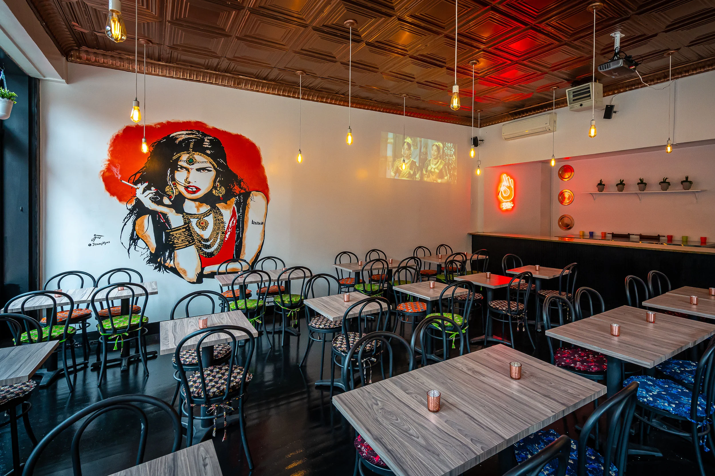 An inside look at Khiladi, where this lady watches you while you eat. Photo Credit: Noah Fecks