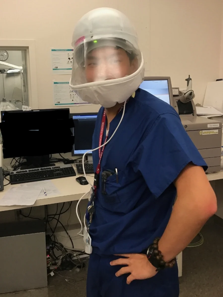 Felix Yap, embracing futuristic technology while on service in the Interventional Radiology suite in 2017.