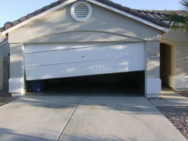 Greensboro-garage-door-fallen-off-tracks.jpg