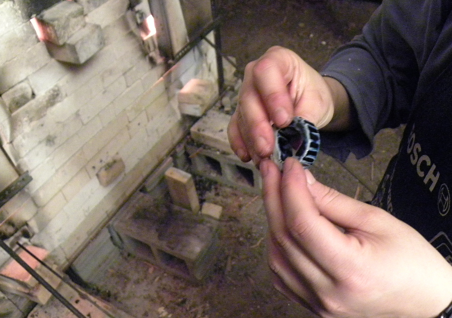 Checking the salt glaze on the ring