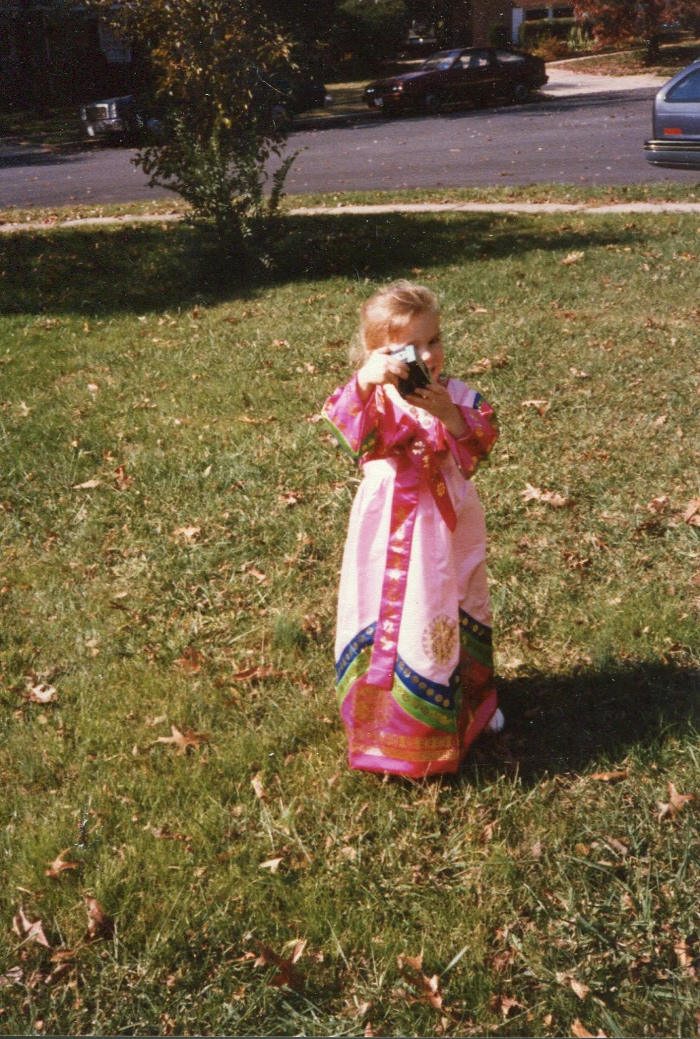 Me in traditional Korean dress, demonstrating an early love for camera.