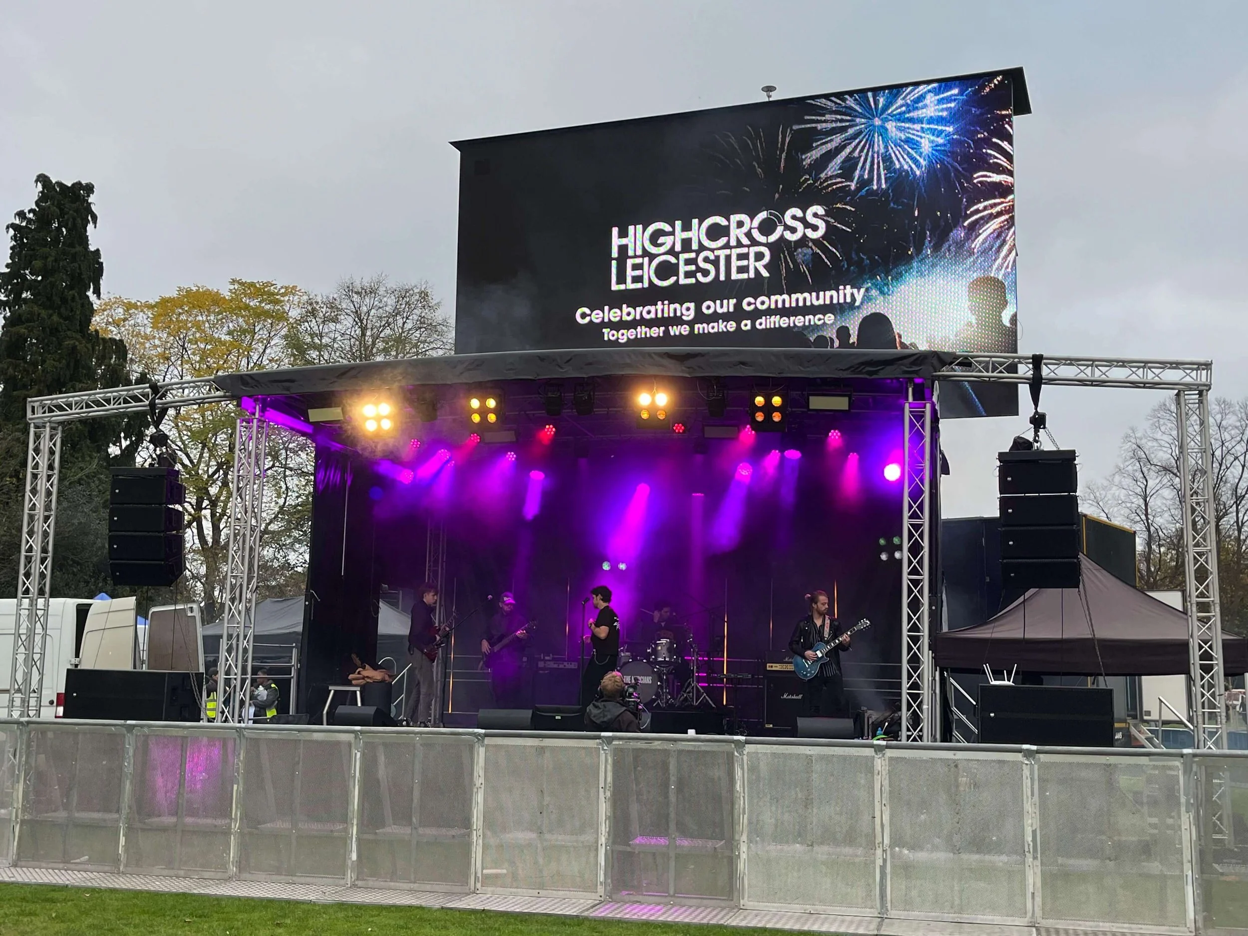 band playing on a stage with lights