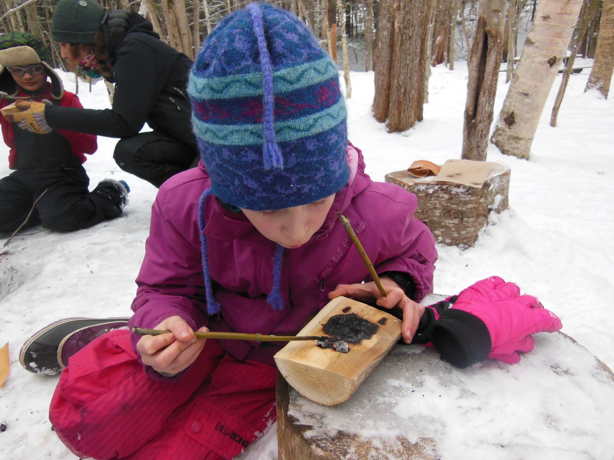 Red Foxes making coal burning bowls in the Young Naturalist program.