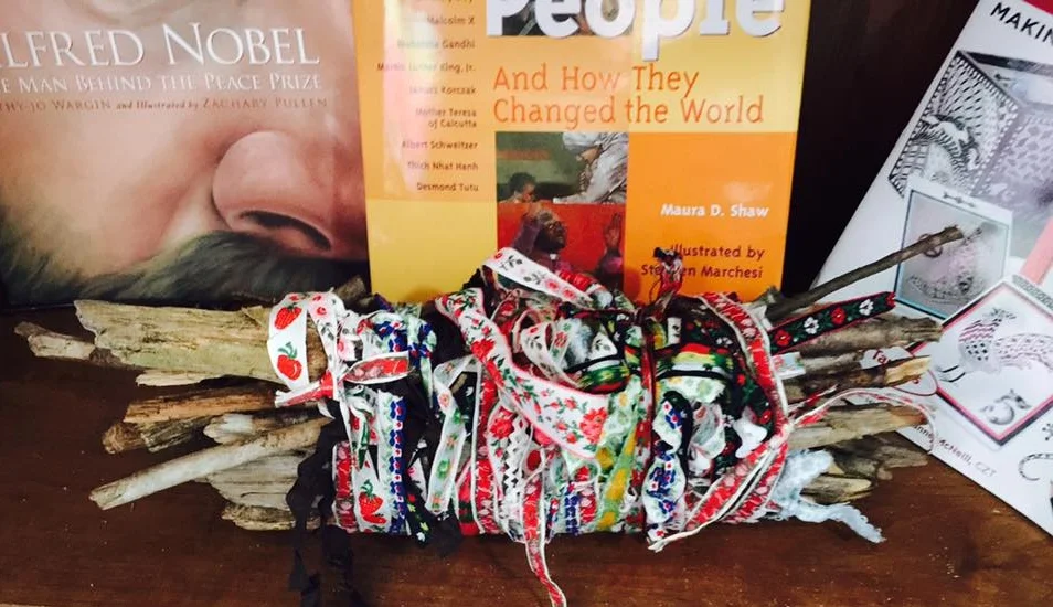 Class peace sticks bundled together, representing unity in our classrooms.
