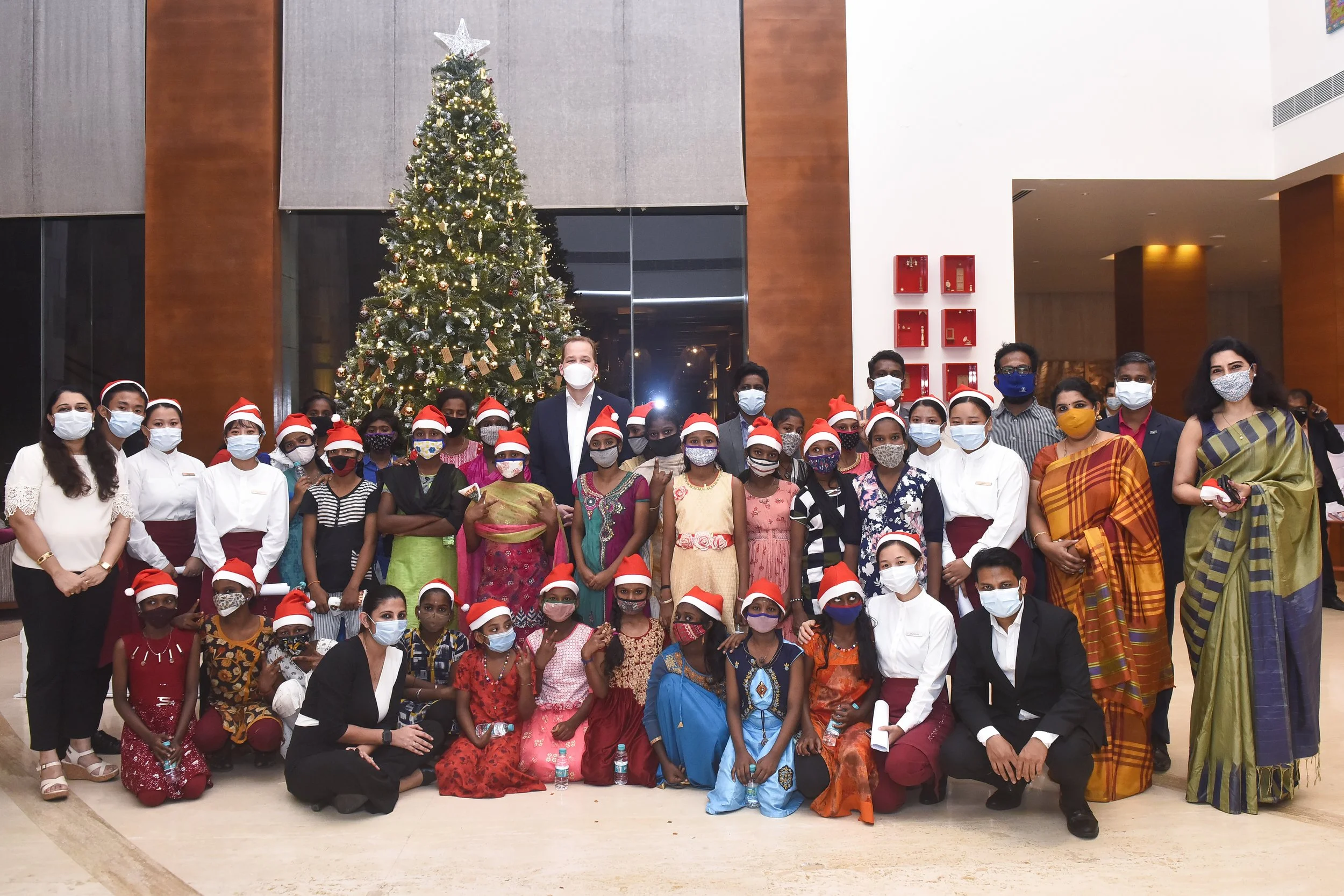 Hotel team, guests and children from Rainbow Home.jpg