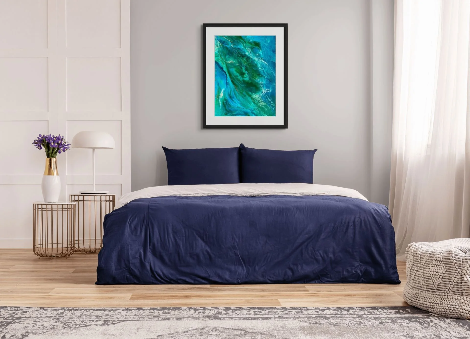 Turquoise and emerald coastal abstract wall art hanging above a bed in a modern bedroom with spa-inspired ocean decor.