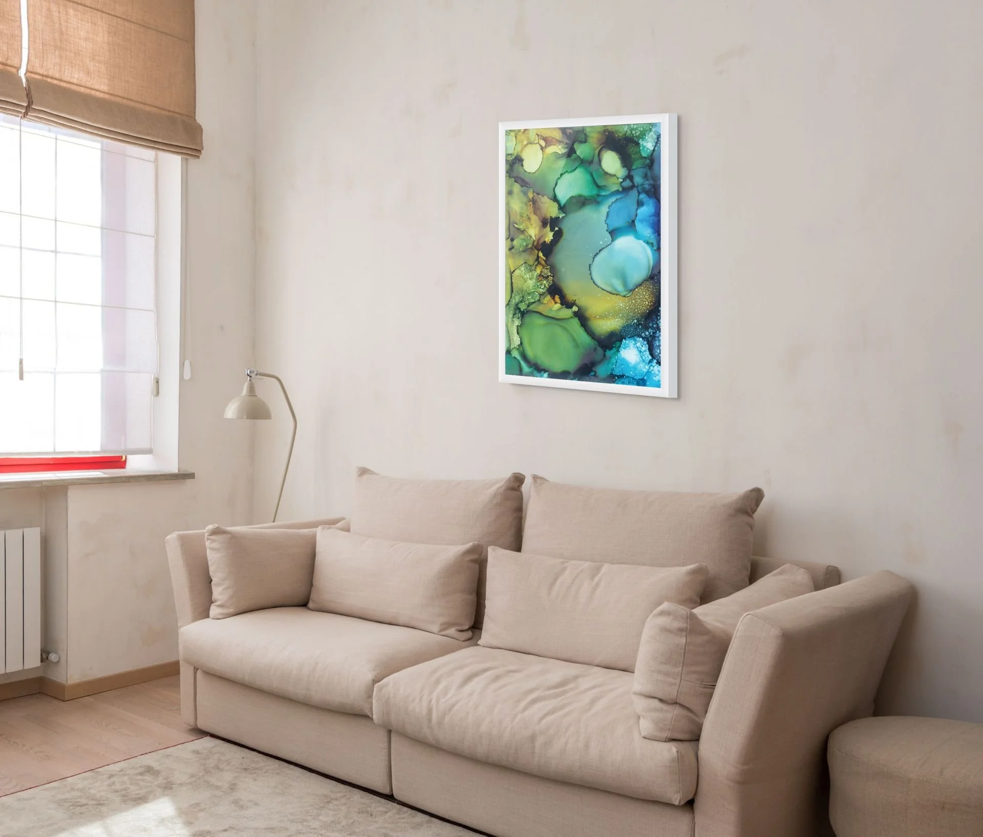 Green and blue coastal abstract wall art displayed in a modern living room with ocean-inspired textures and beach house decor styling.
