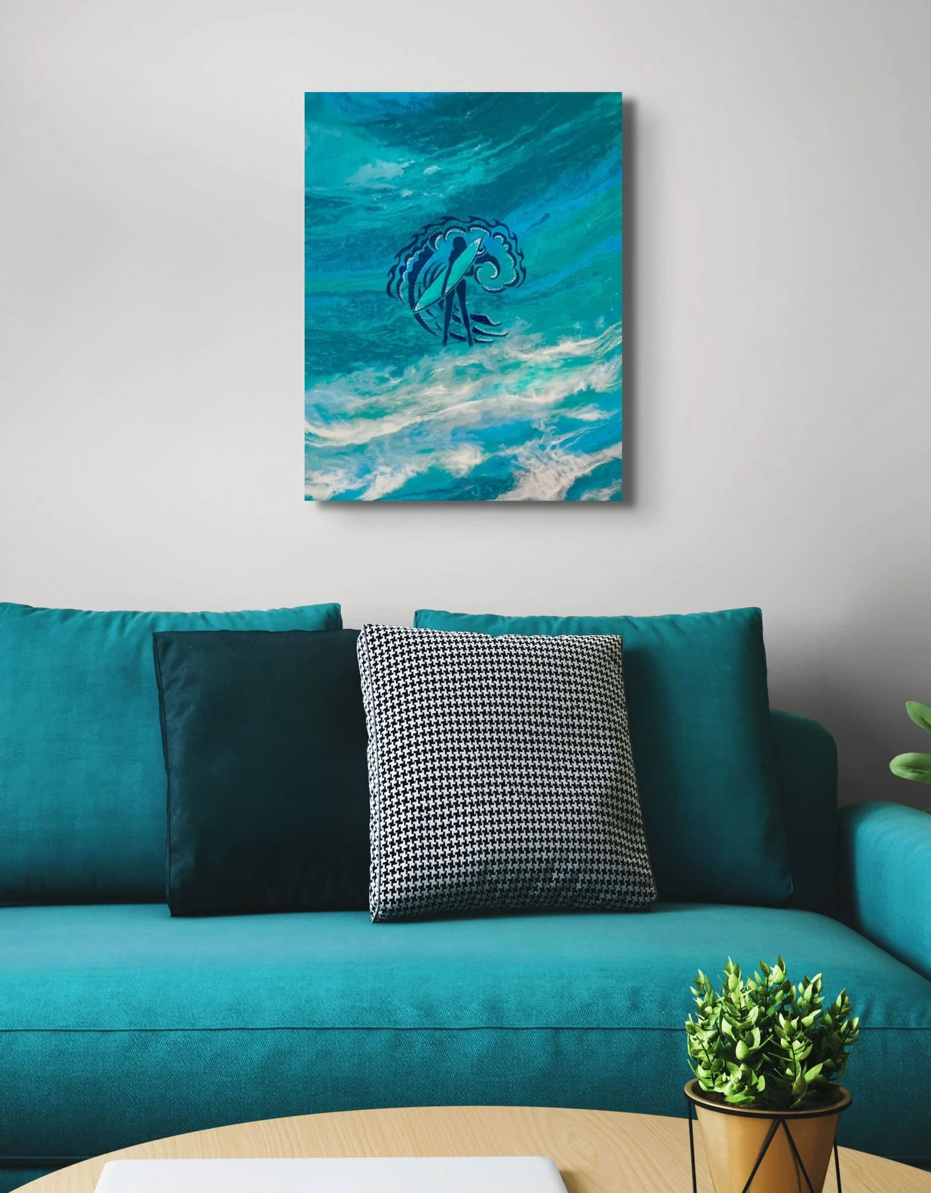 Blue coastal wave wall art displayed above a teal sofa in a modern living room with beach-inspired home decor.