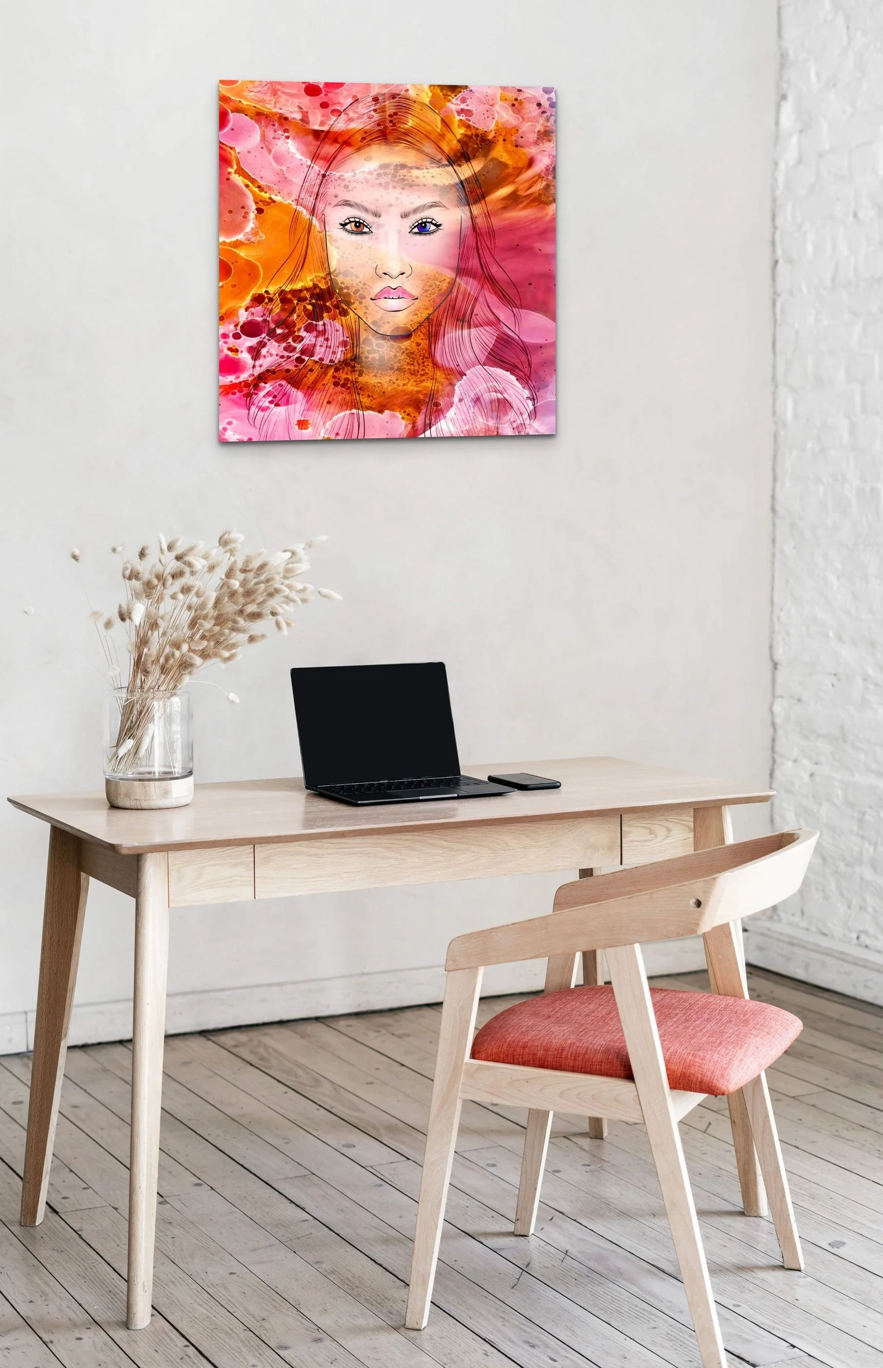 Vibrant feminine portrait wall art with fiery orange and pink abstract textures displayed in a contemporary home interior.