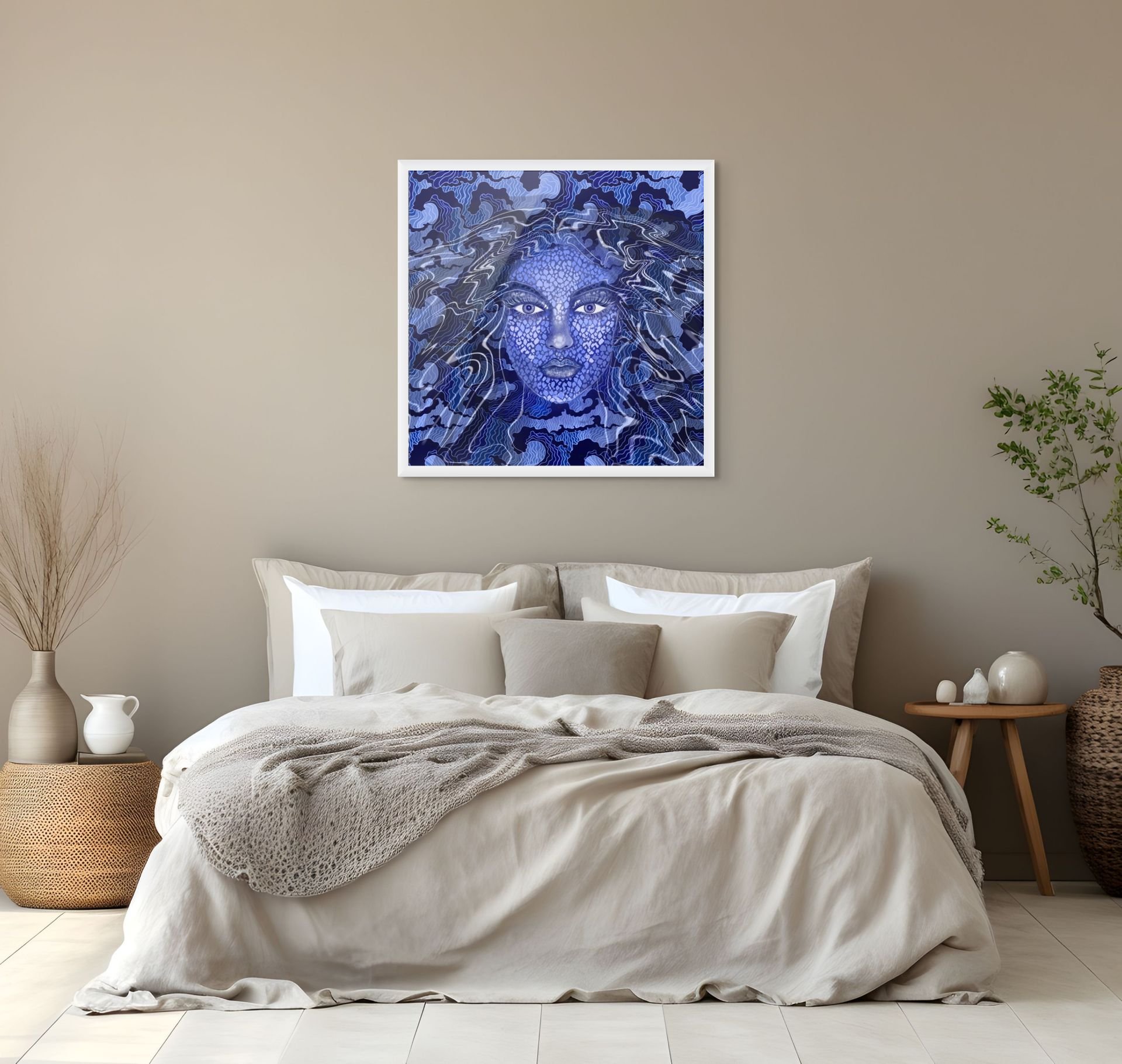 Blue cosmic woman portrait wall art hanging above a bed in a calming coastal bedroom with celestial abstract styling.