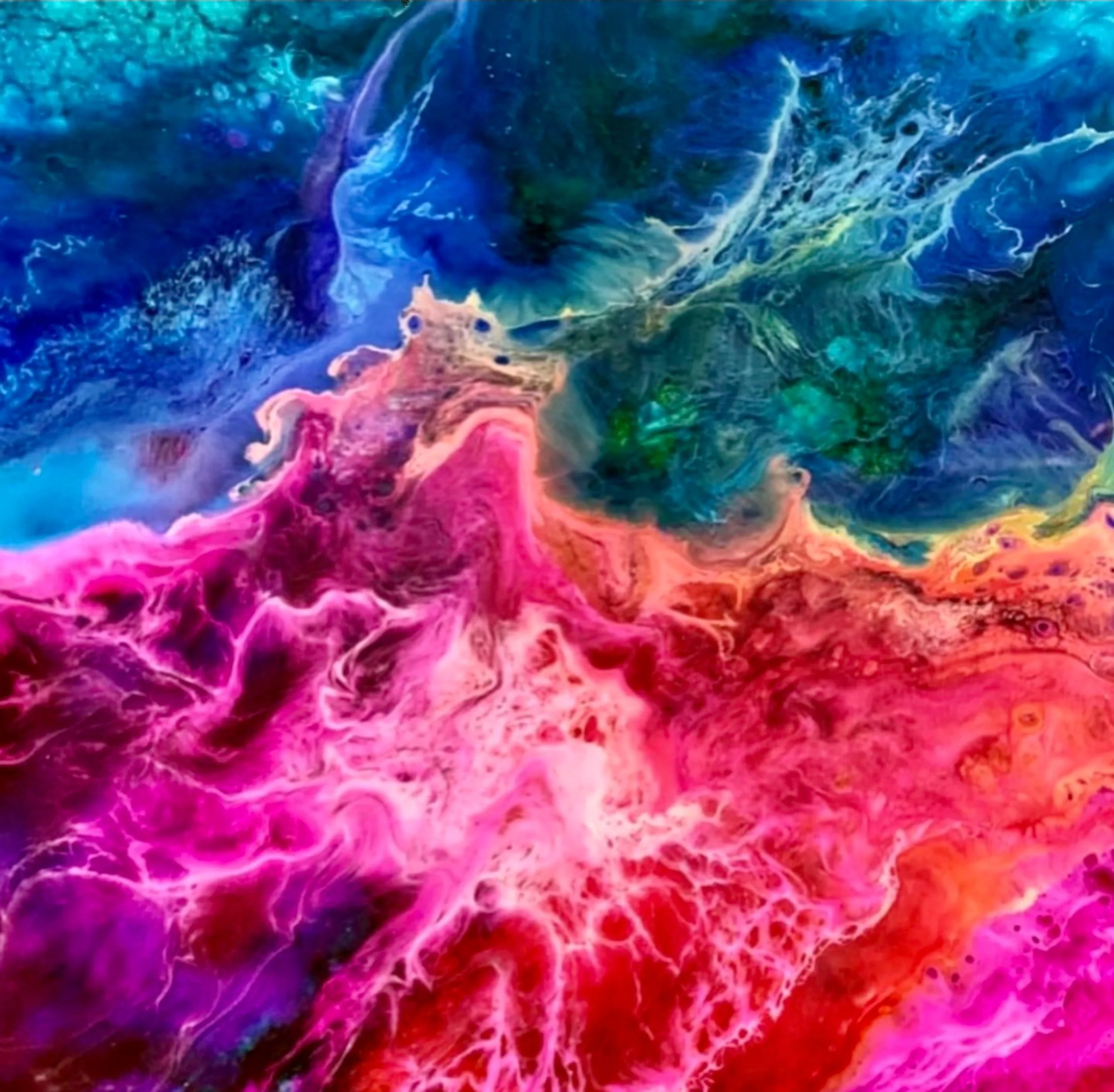 Colorful abstract alcohol ink painting with neon pink, deep blue, teal, and white swirling fluid textures.