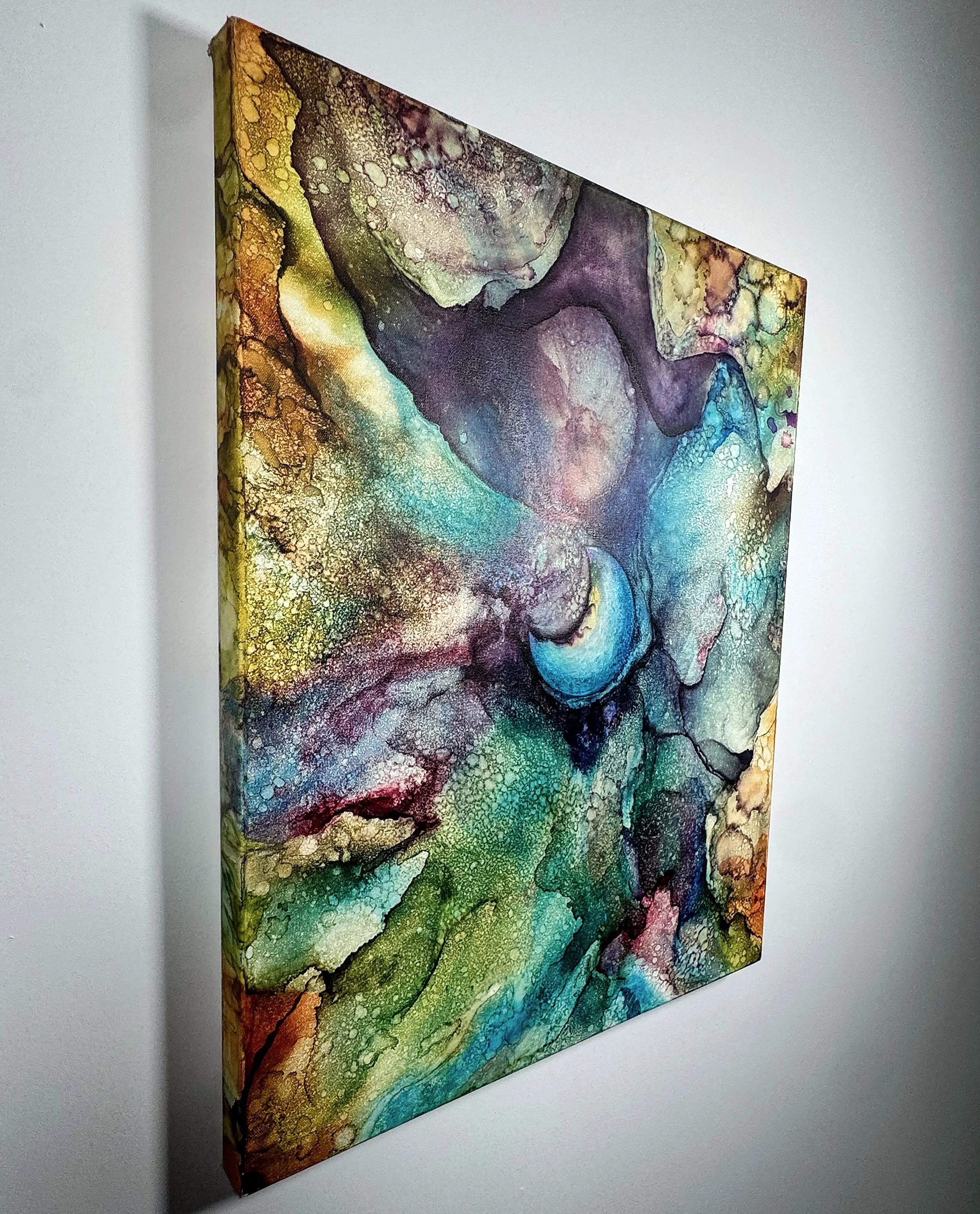Side angle gallery wrapped canvas, colorful abstract alcohol ink wall art on gallery-wrapped canvas with rich celestial teal, gold, and purple textures for modern home decor.