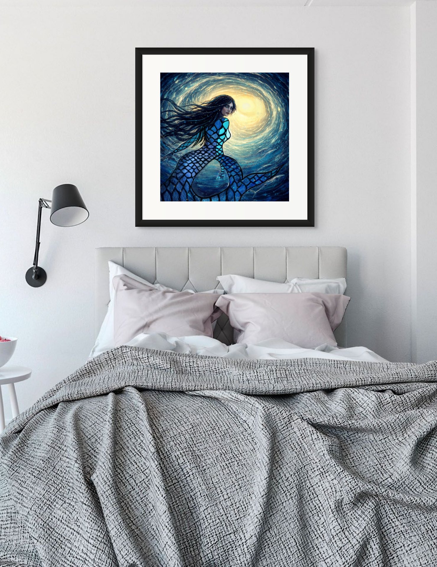 Blue mermaid coastal wall art hanging above a bed in a calming beach house bedroom with ocean-inspired decor styling.