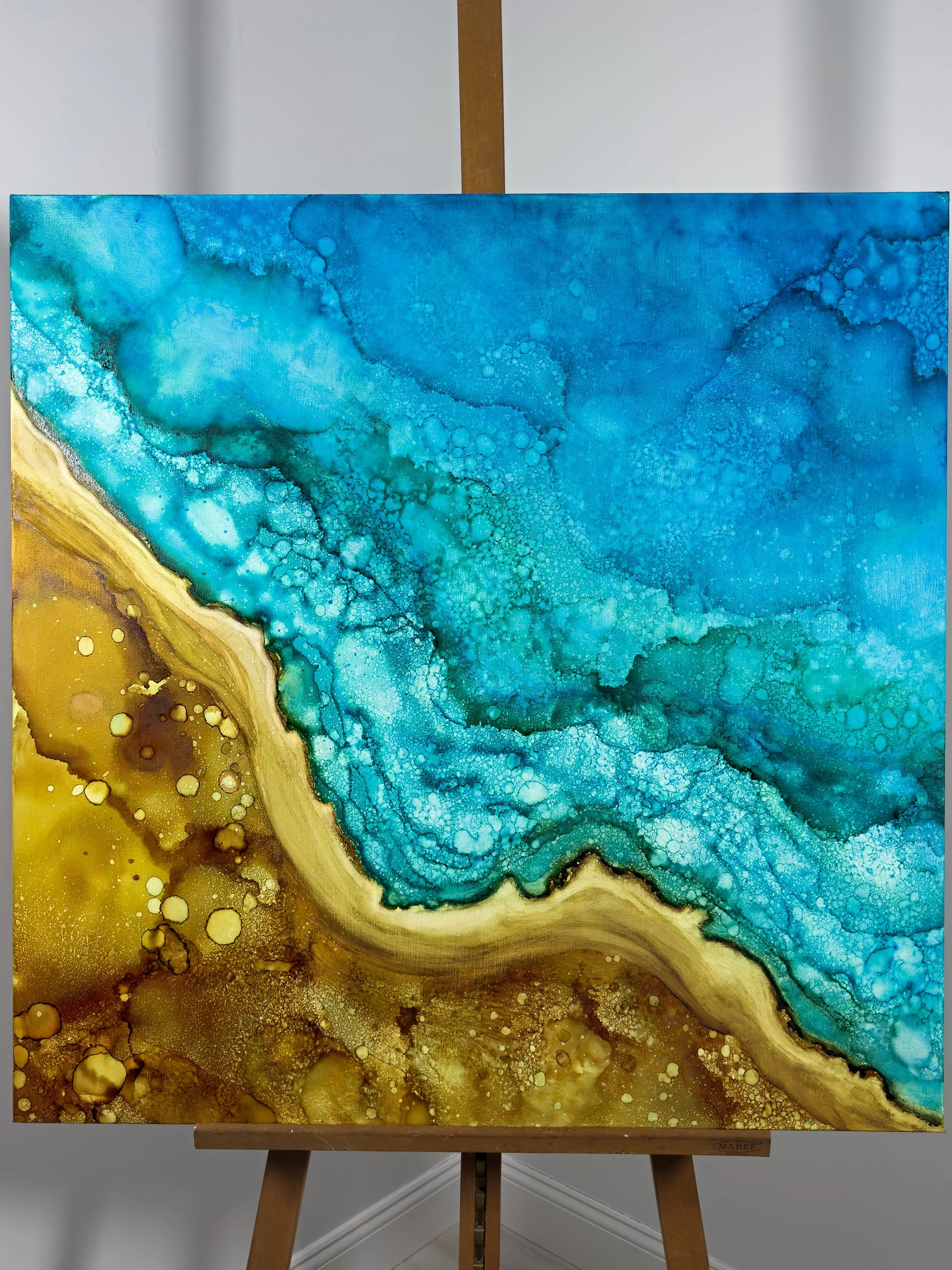 salty dream abstract art in easel beach home.