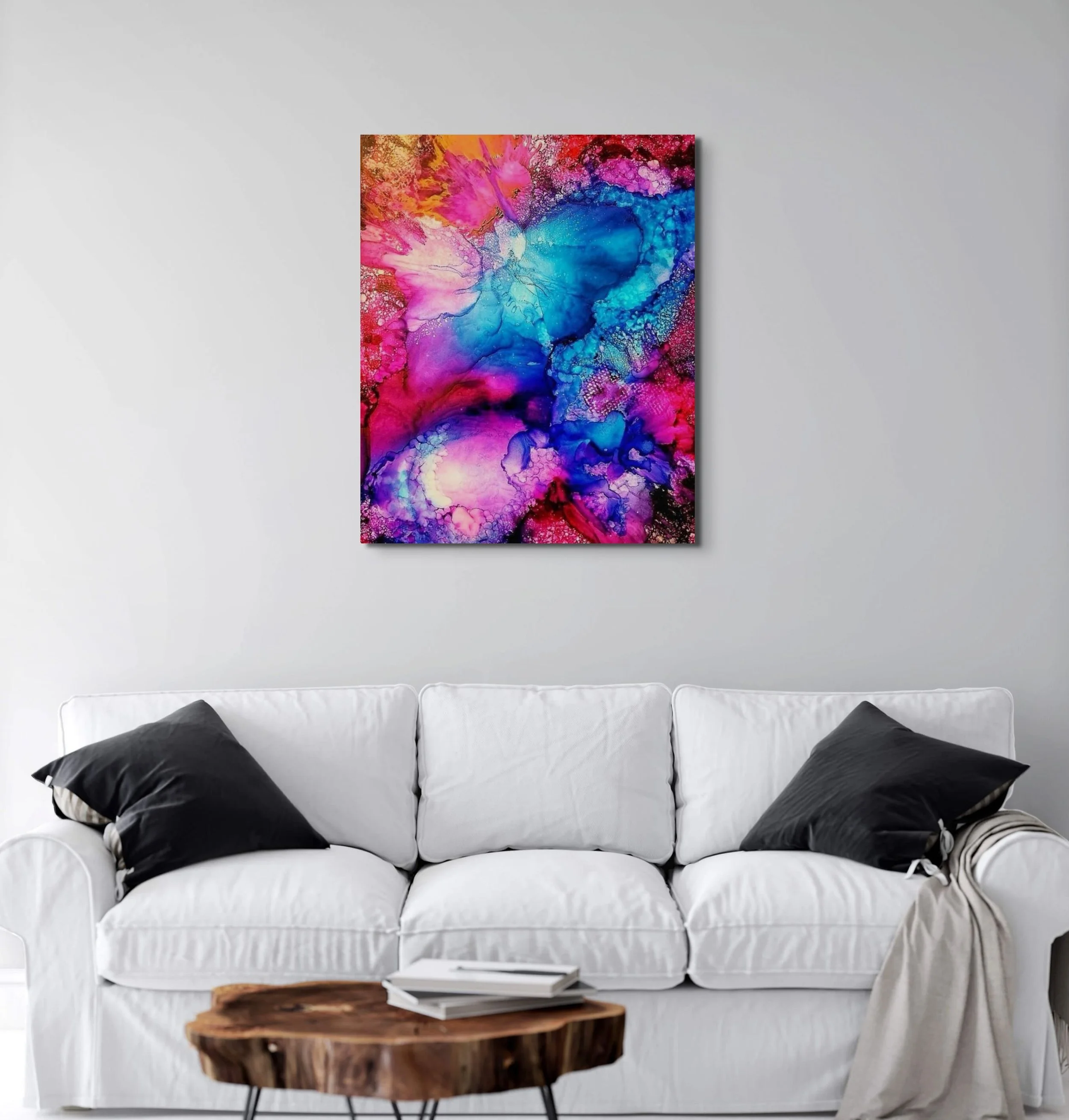 Colorful cosmic abstract wall art with pink, blue, and purple textures displayed in a modern contemporary home interior.