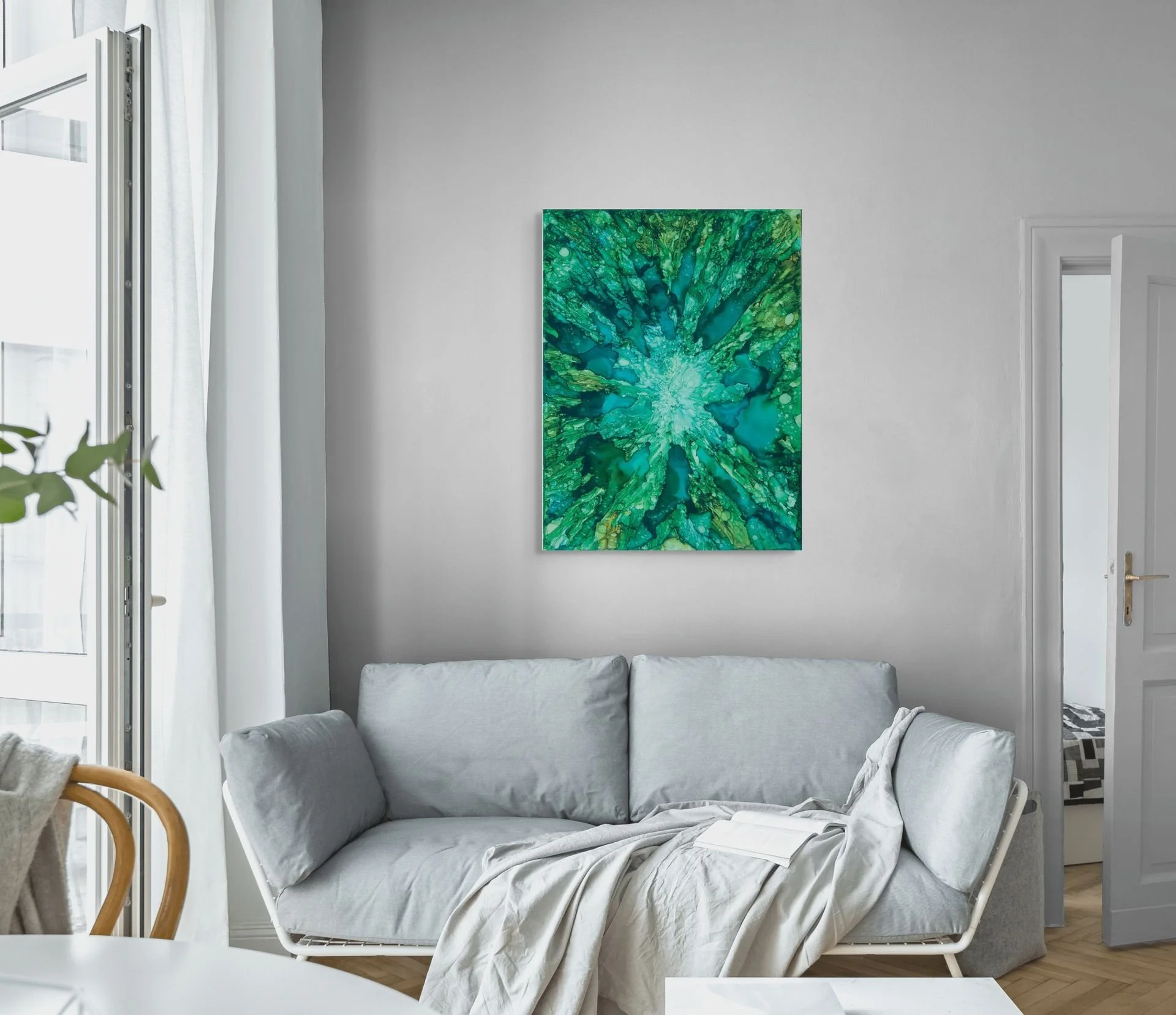 Green and teal coastal abstract wall art displayed in a modern living room with ocean-inspired textures and calming contemporary decor.