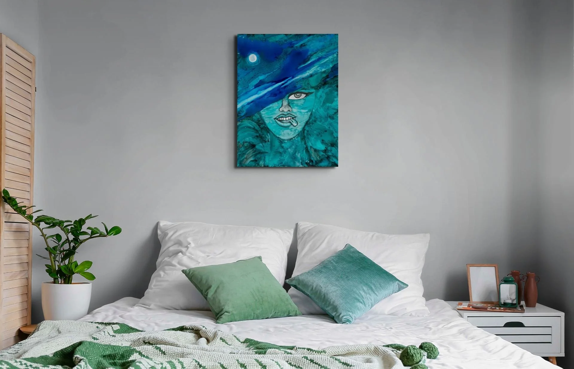 Turquoise coastal woman wall art hanging above a bed in a modern bedroom with ocean-inspired decor and calming blue tones.