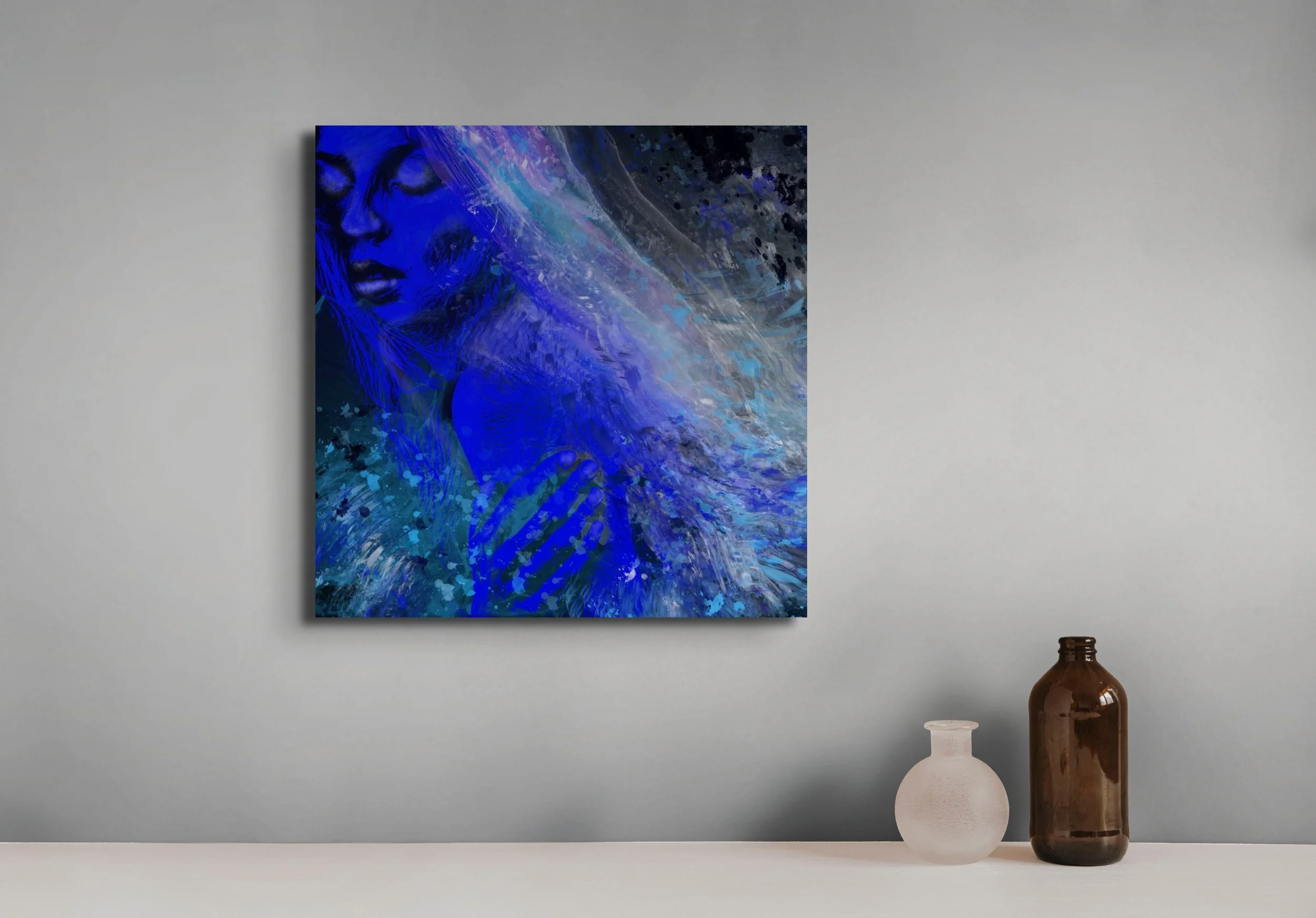 Blue coastal woman portrait wall art with flowing wave textures displayed in a modern beach-inspired interior space.