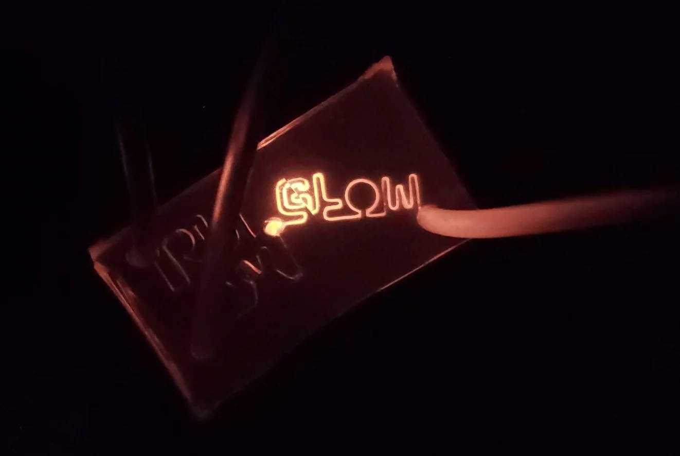 A flow device fabricated from Shrinky Dinks to visualize chemiluminescence. Images captured using an android mobile device and a LEGO architecture.