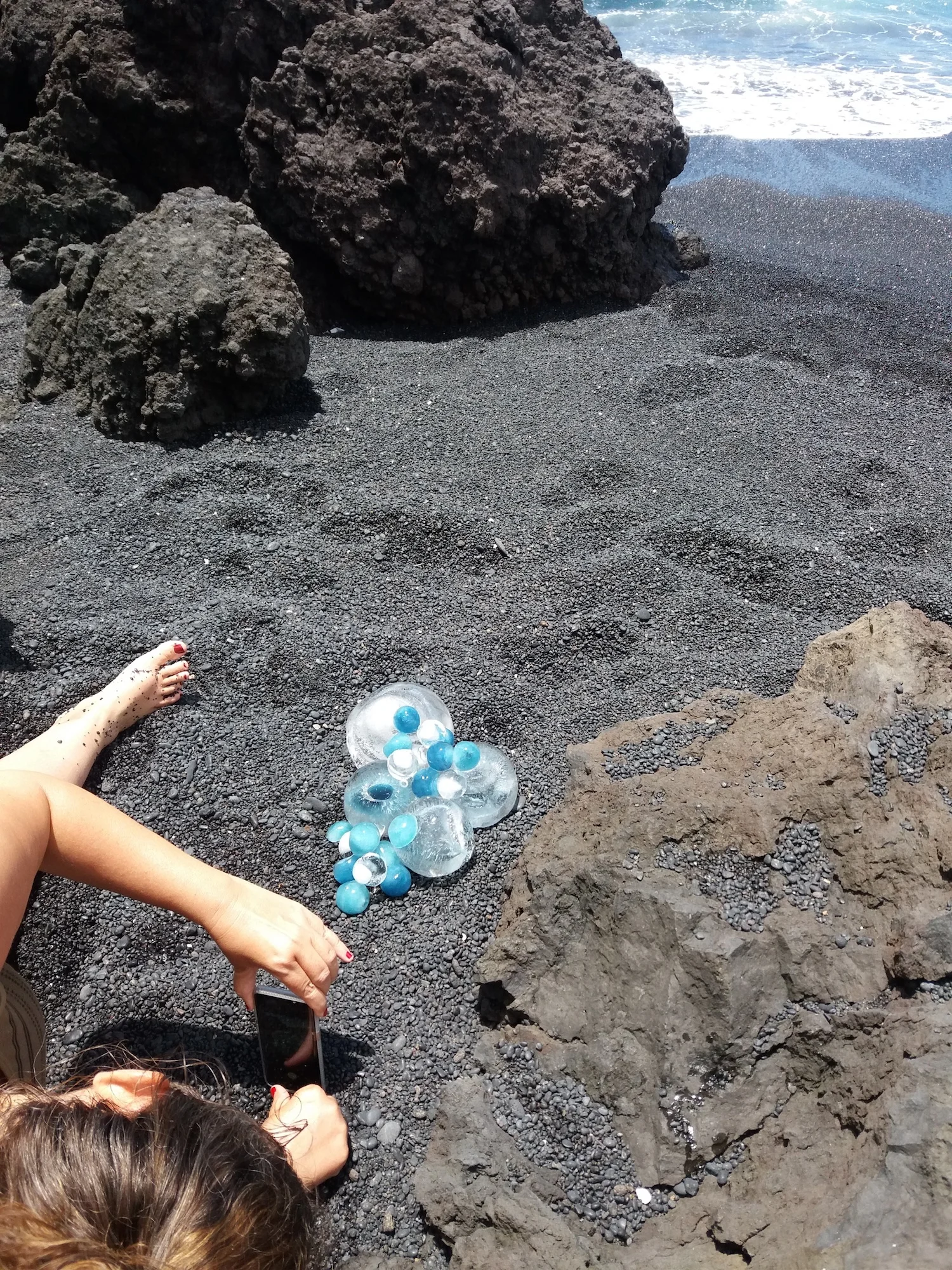 Getting a dose of hot lava rock during an ice installation on the black sands of Maui, June 2018.