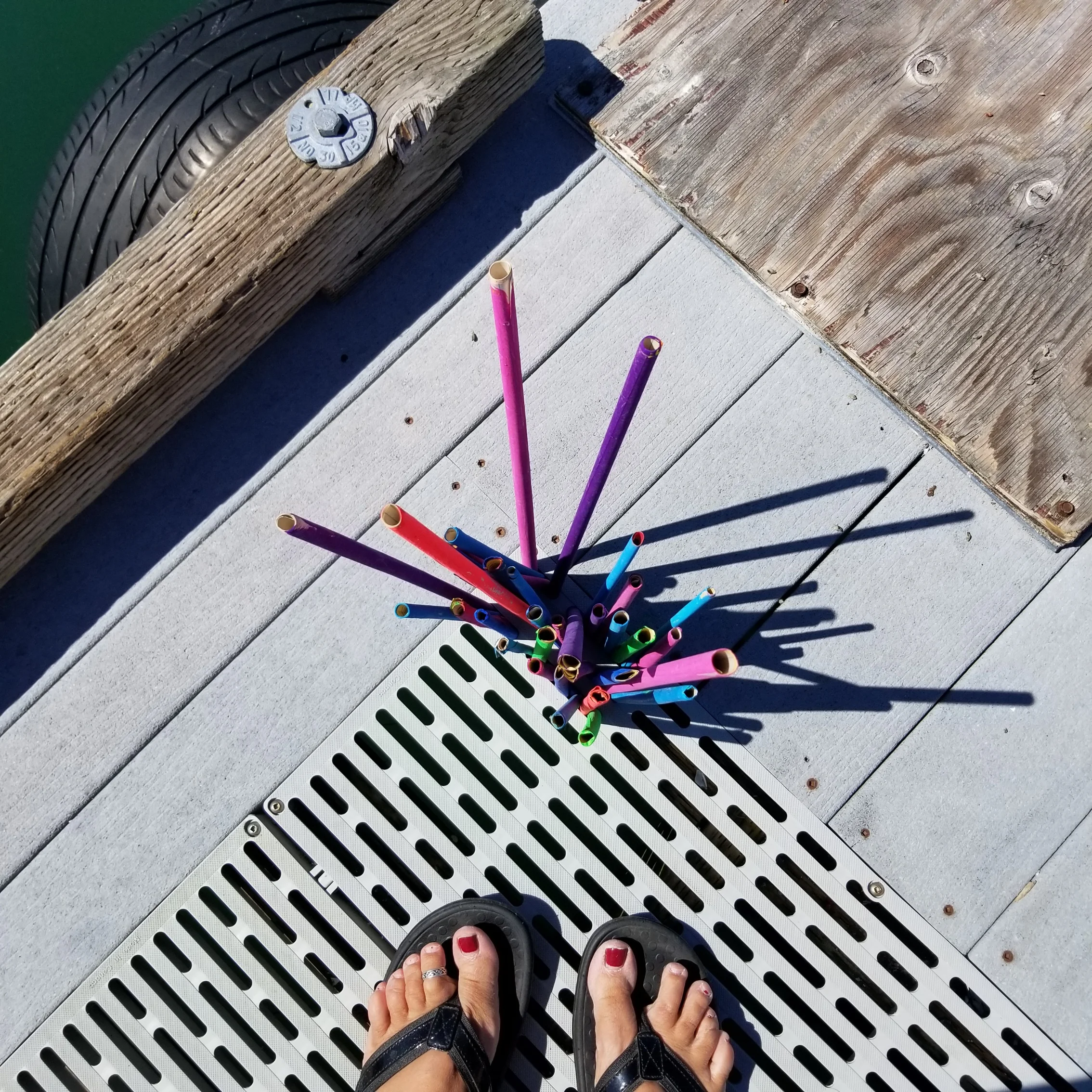 Flip flops were made for installation! Placing a few colorful sticks on a dock in Union, Washington.