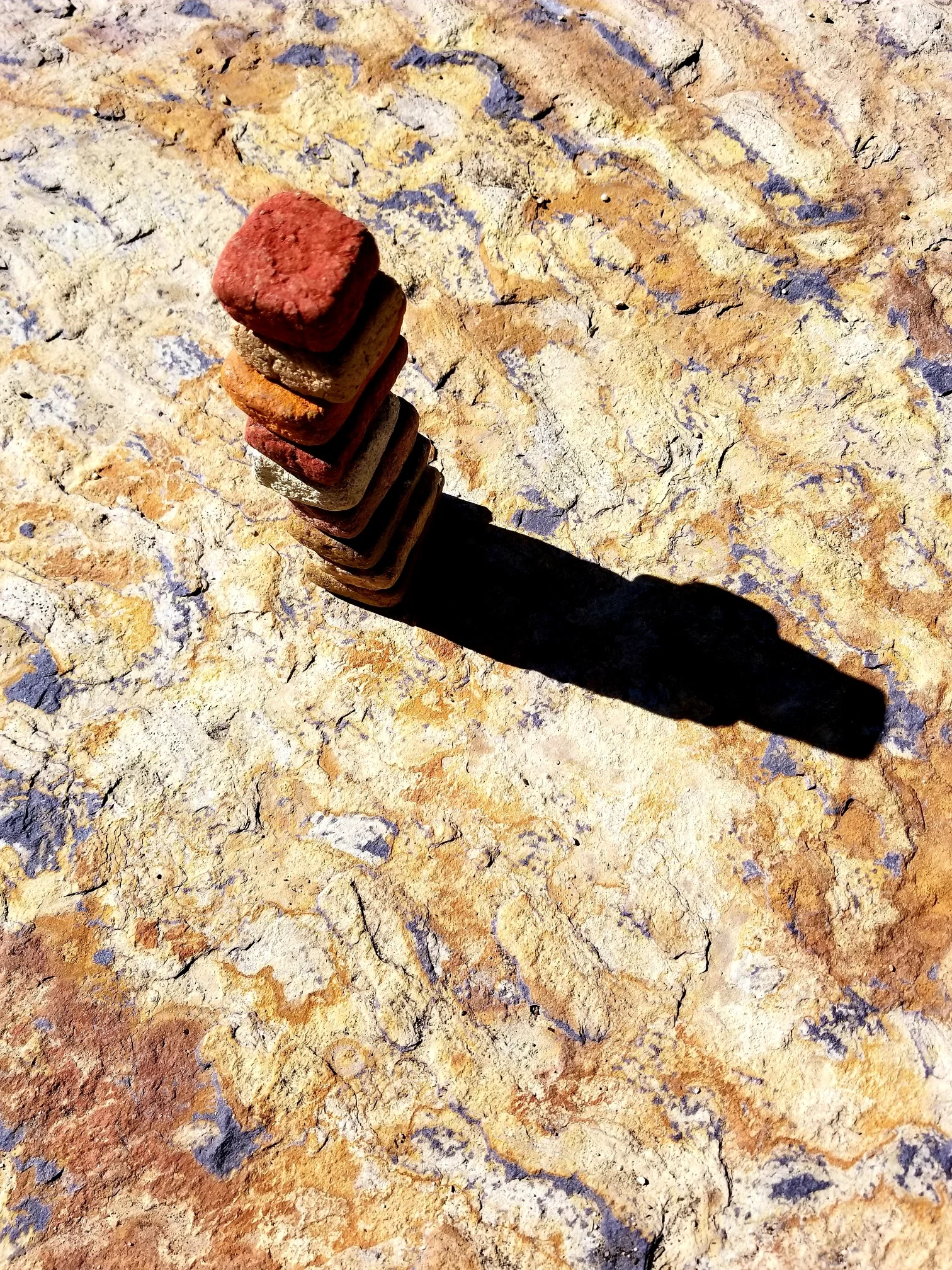 Earth pigment paper pulp stacked on a boulder bursting with minerals, Little Redfish Lake, Idaho, August 2019.