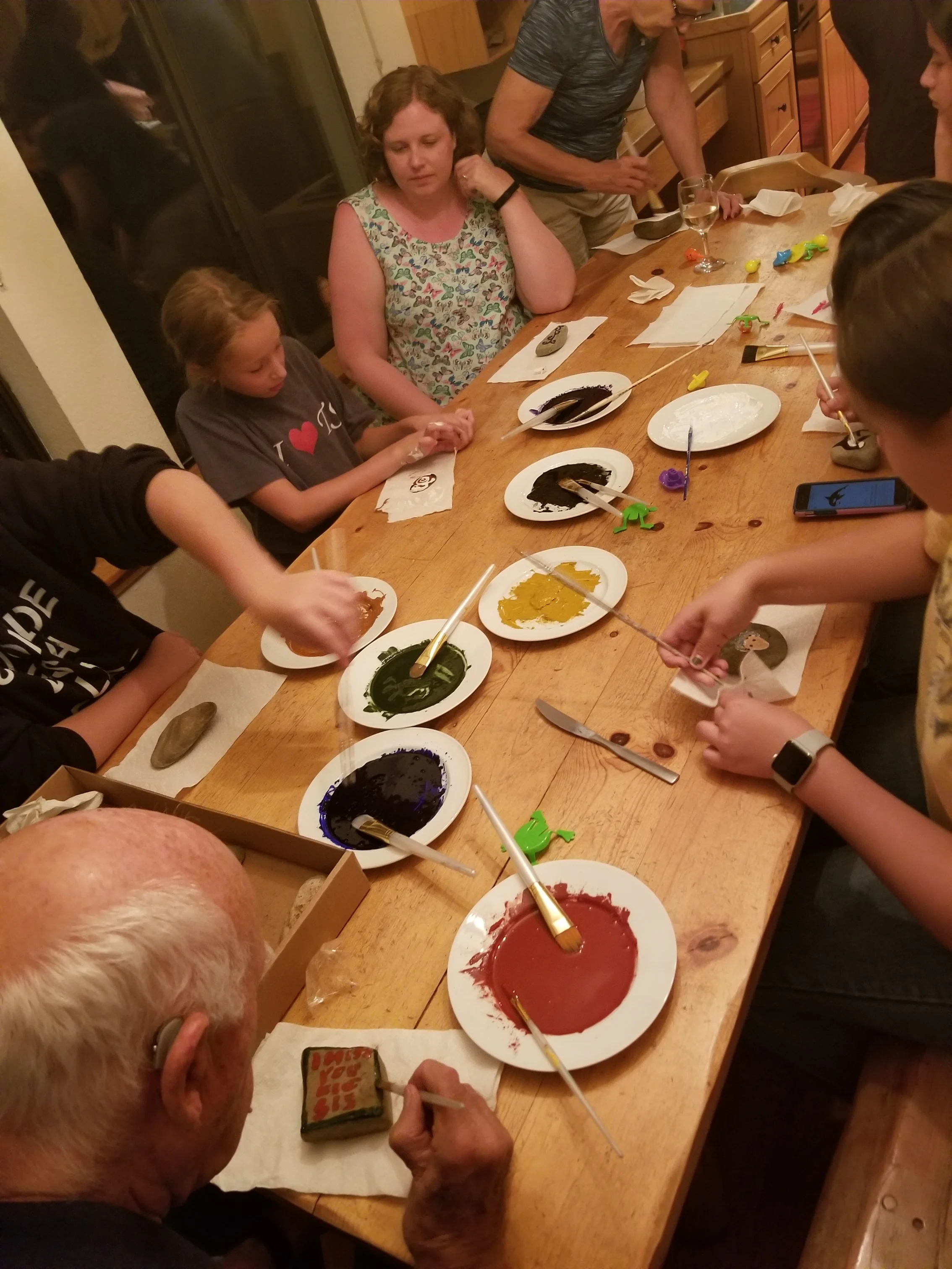My family gathered for an evening of river stone painting with earth pigments and walnut oil, Ketchum, Idaho.