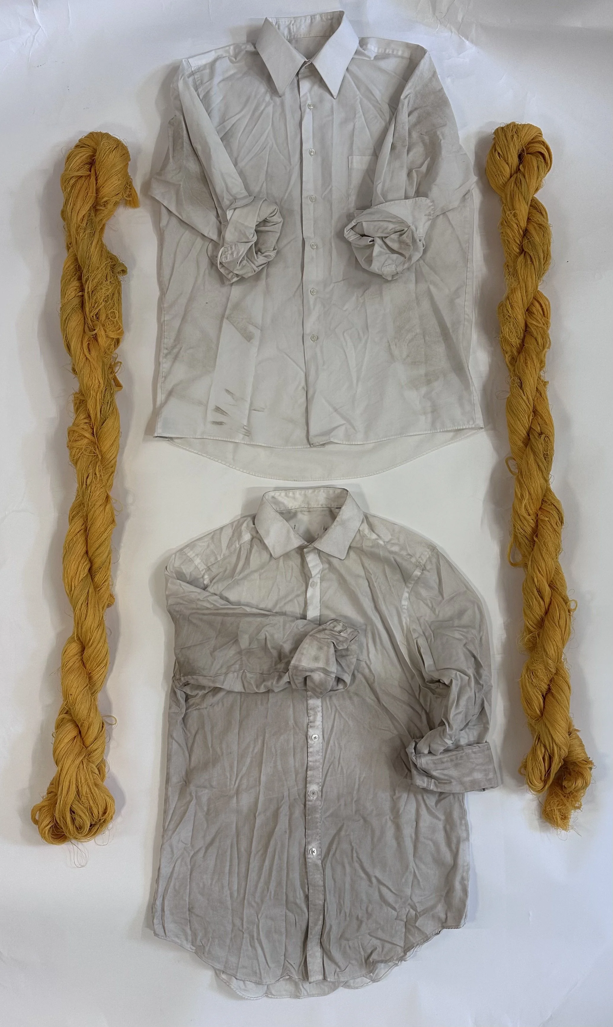  Materials resulting from the installation “Spinning Lines” (string) and performance “Ruts of Repetitiion” (work shirts), 2022.  
