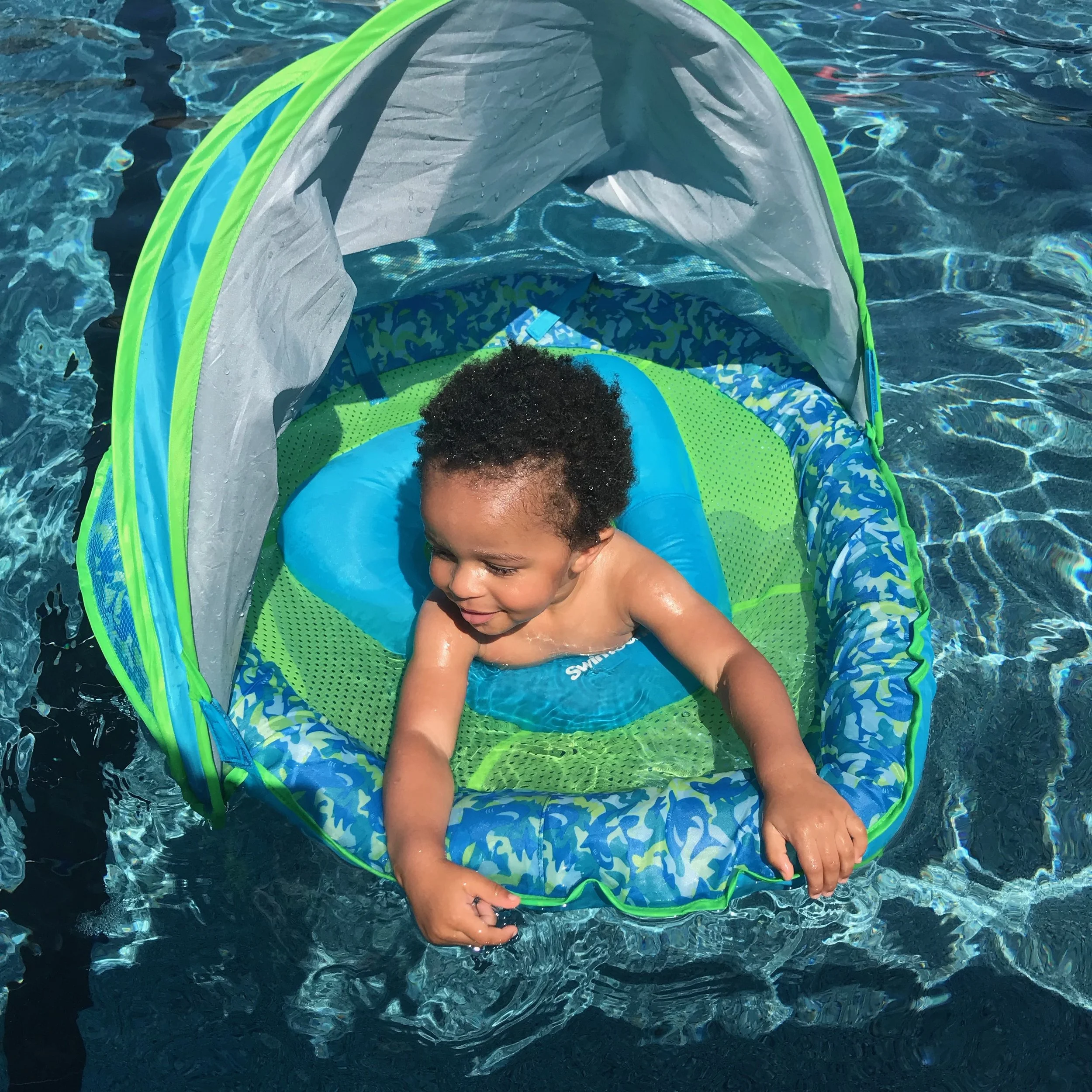Baby Floats In Pool