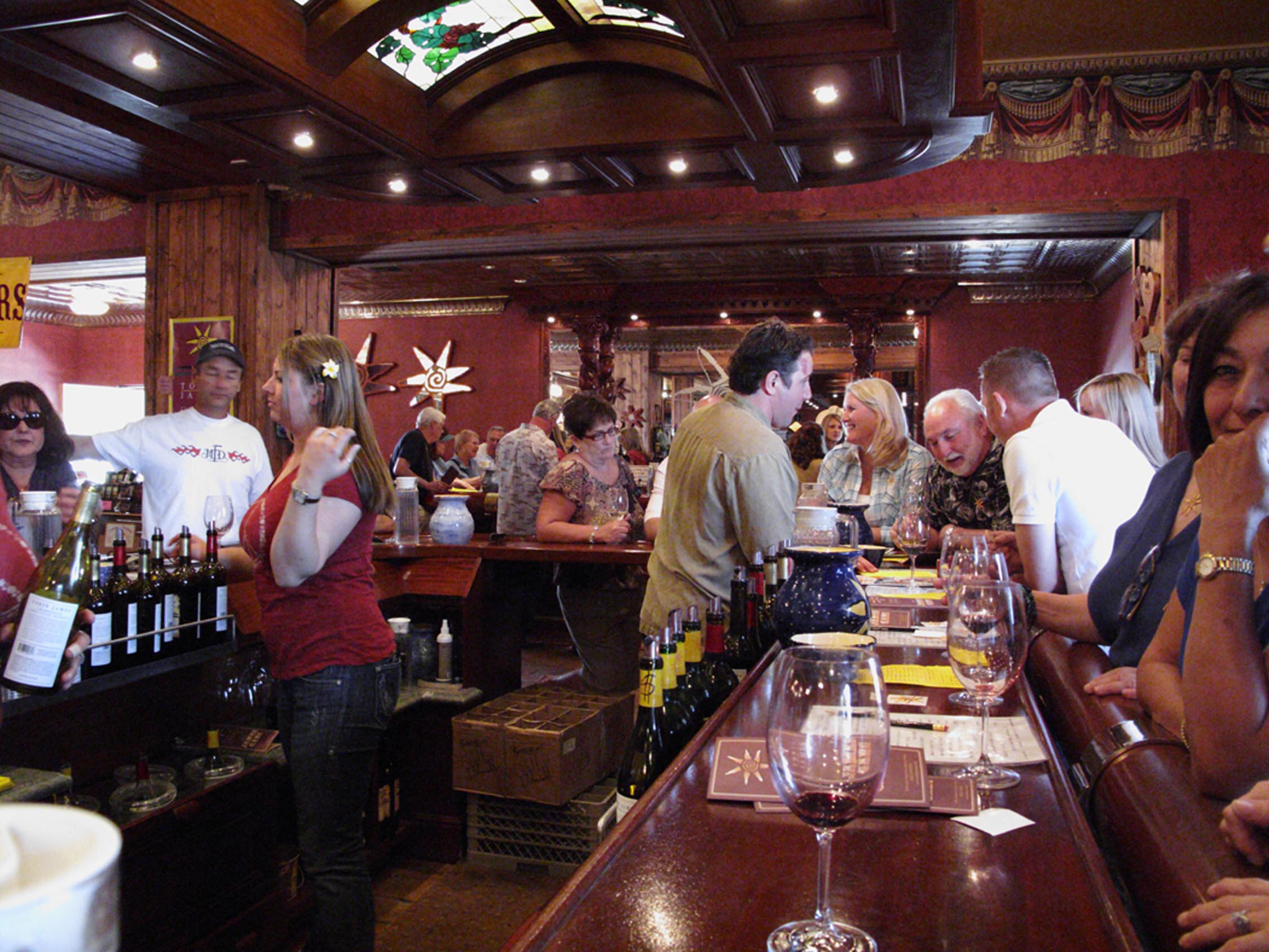 Customers tasting at the bar