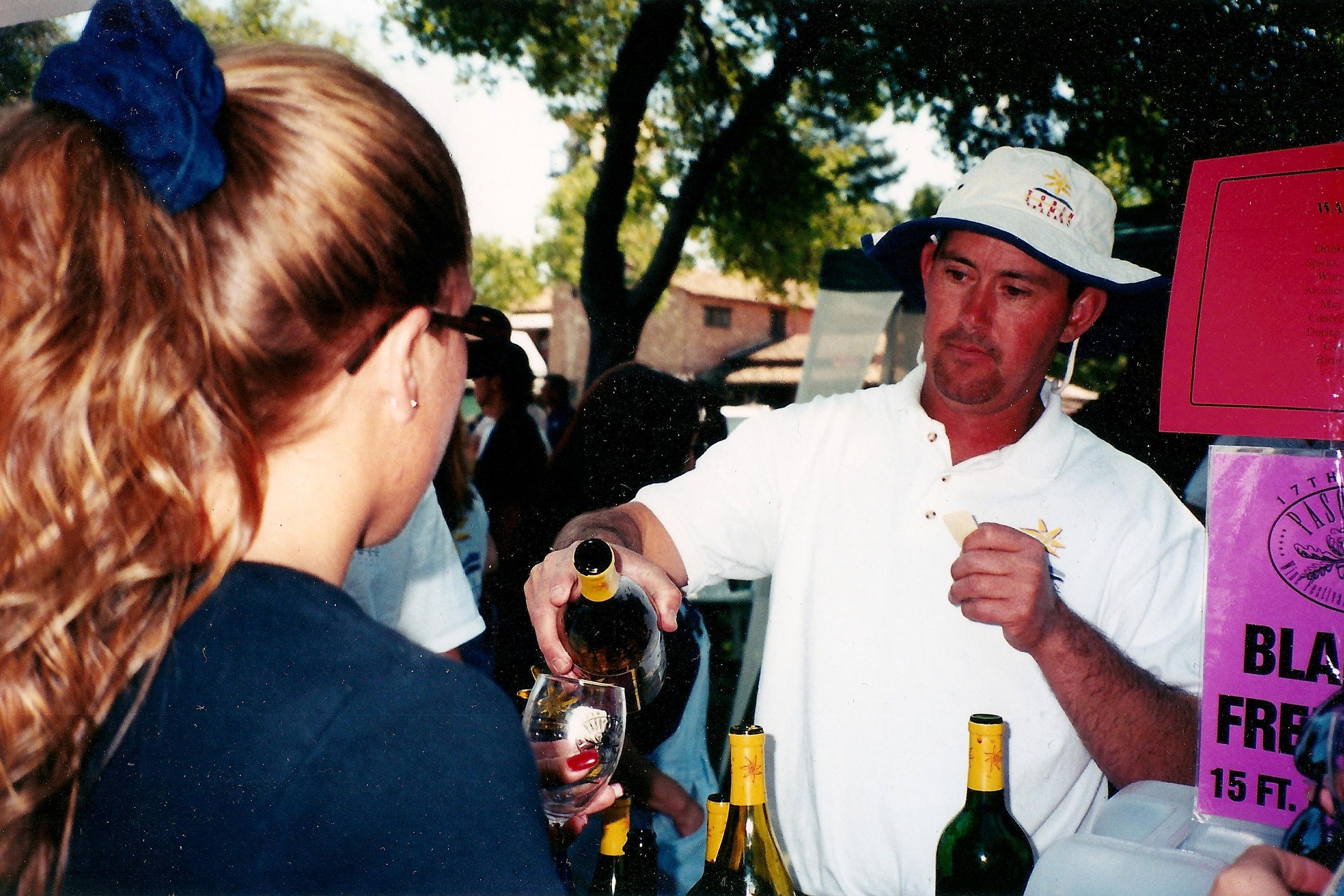 Tim Martin pouring wine at Wine Festival