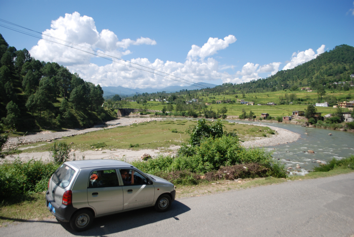 Himalayan foothils in Uttarakand and a CNG-powered car