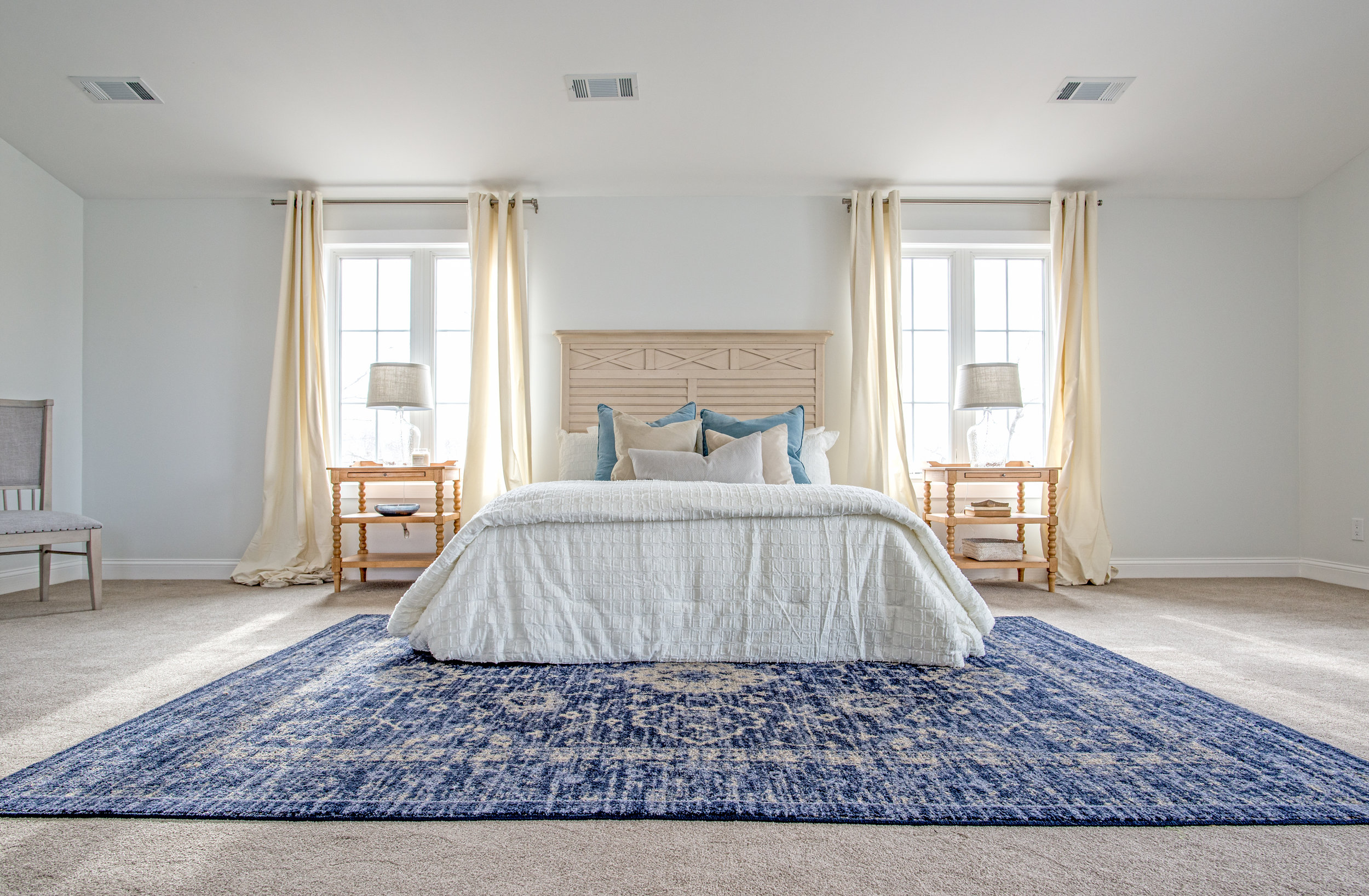 A simple staged bedroom at a recent shoot in Lake Lotawana for RootedKC Design & Realty.