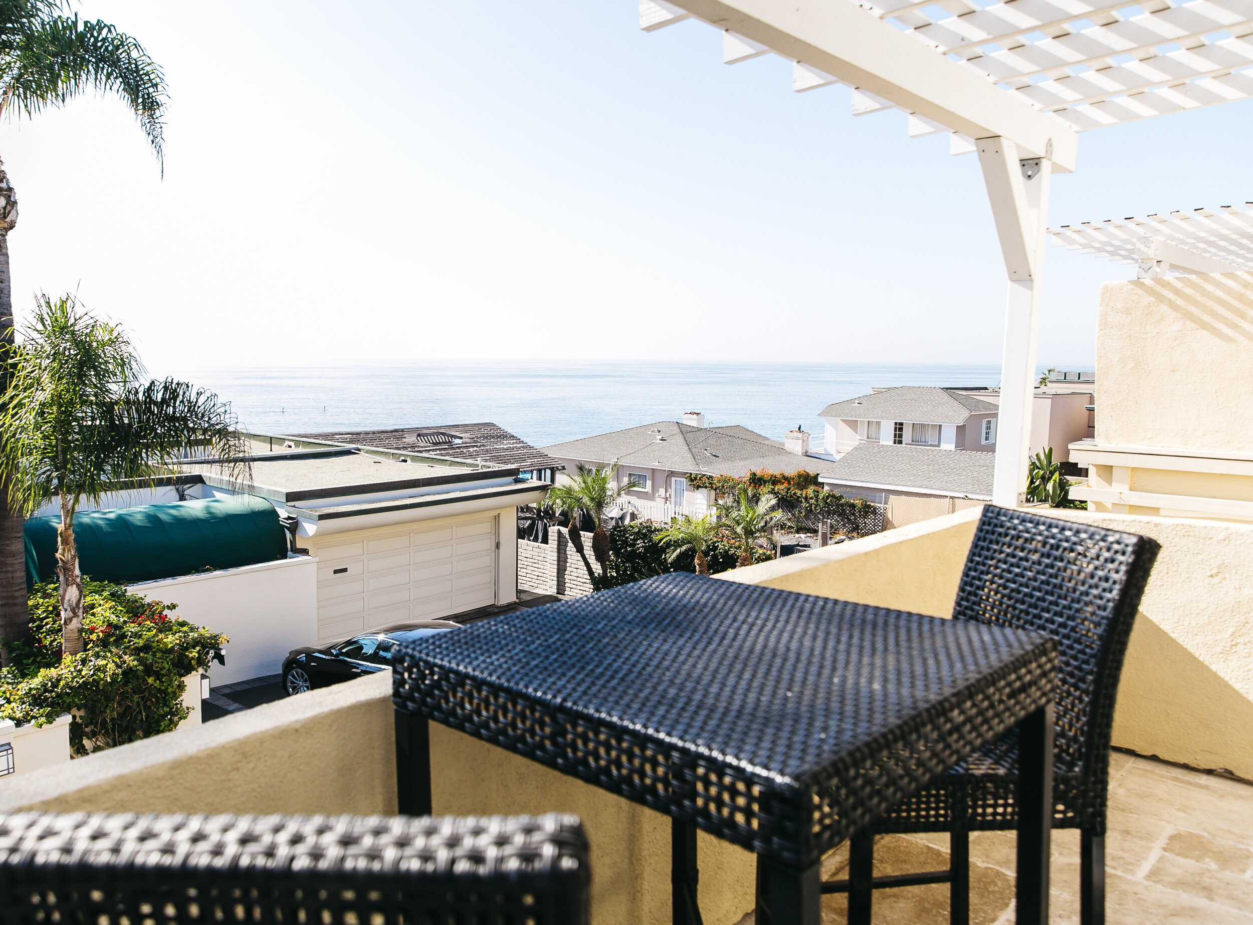 balcony with outdoor table and chairs