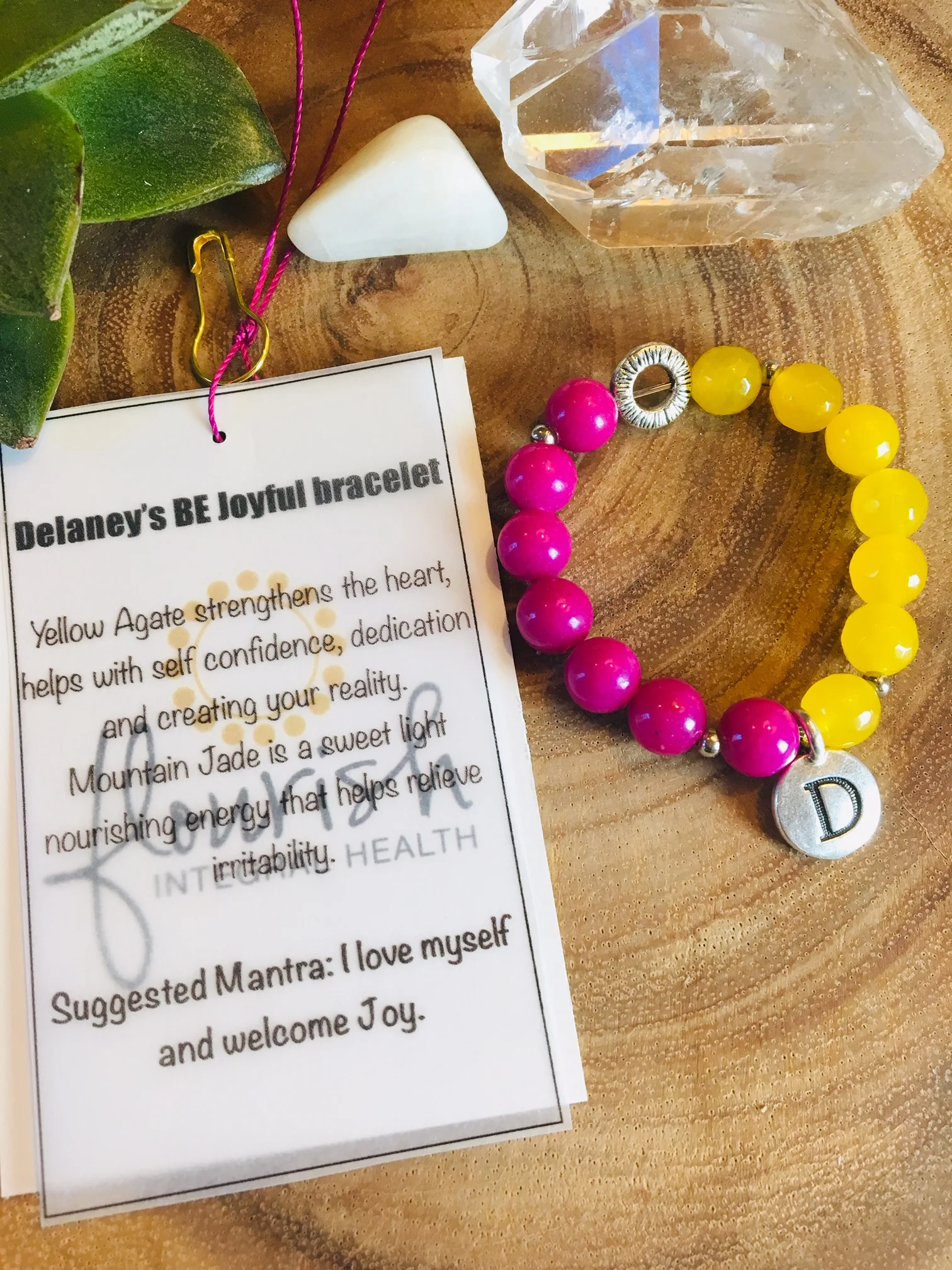 Delaney's BE bracelet with tag.jpg