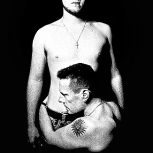 The Songs of Innocence cover was a picture of Larry Mullen Jr. embracing his 18 year-old son, Elvis.