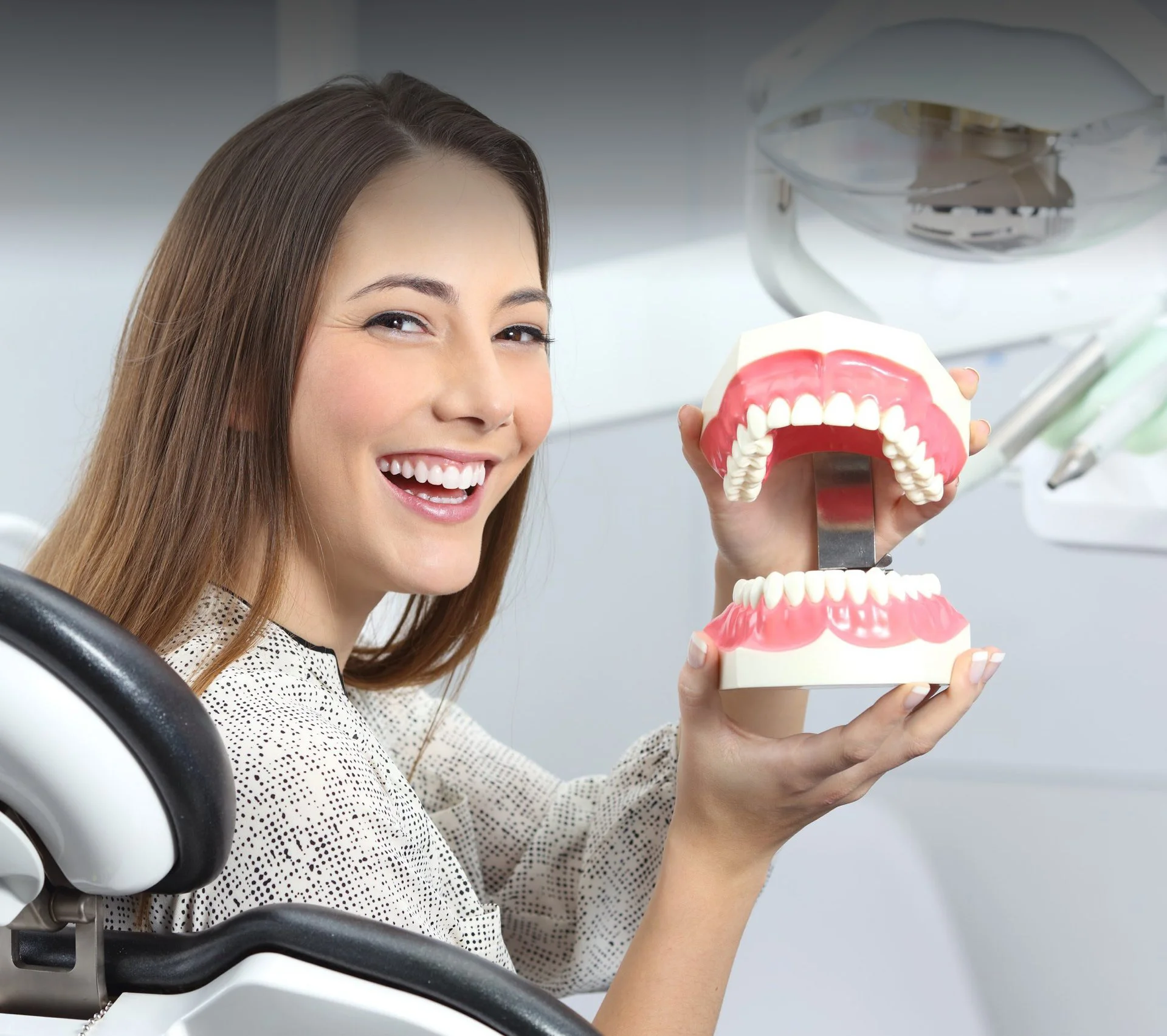 smiling lady with teeth model - gradient.jpg