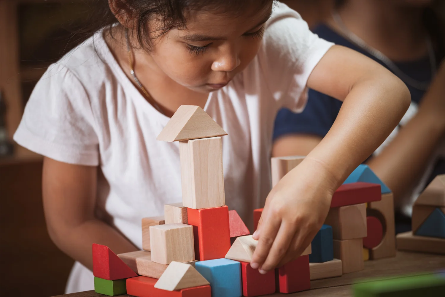 Girl playing with blocks.jpg