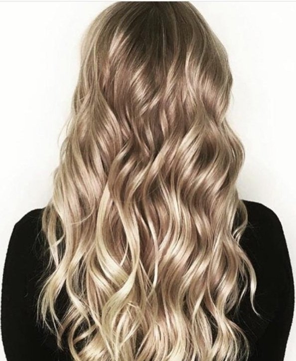 Blonde highlights on long curly hair