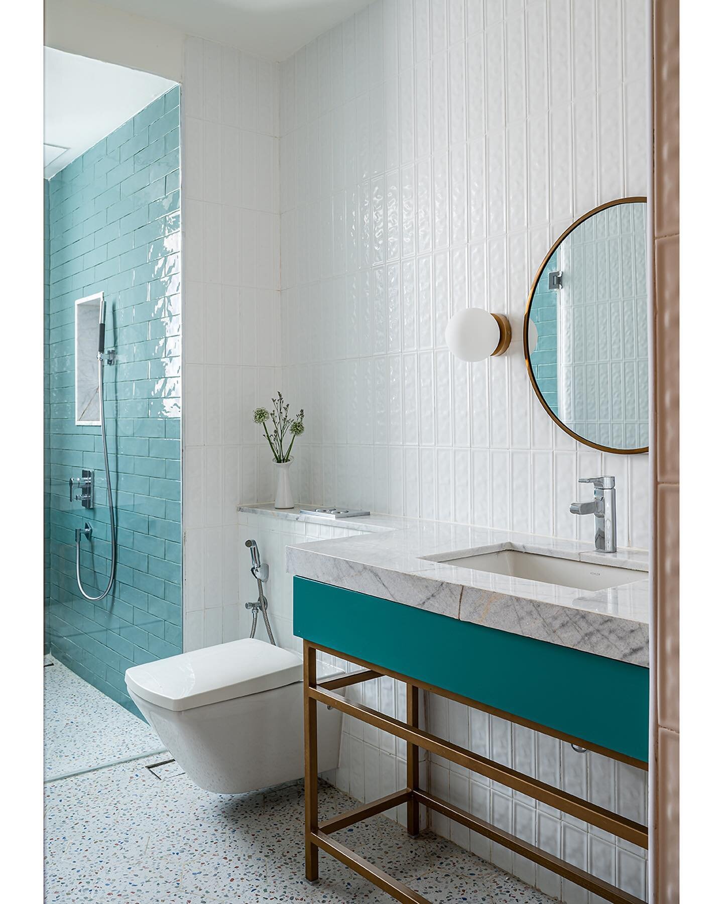 Crisp and brimming with life, the child&rsquo;s bathroom is a heady mix of white and aqua. The hexagonal terrazzo tiles meshed with gold inlay traverse the floors, meeting the subway tiles. The vanity comprises upcycled white marble, a pop of teal, a